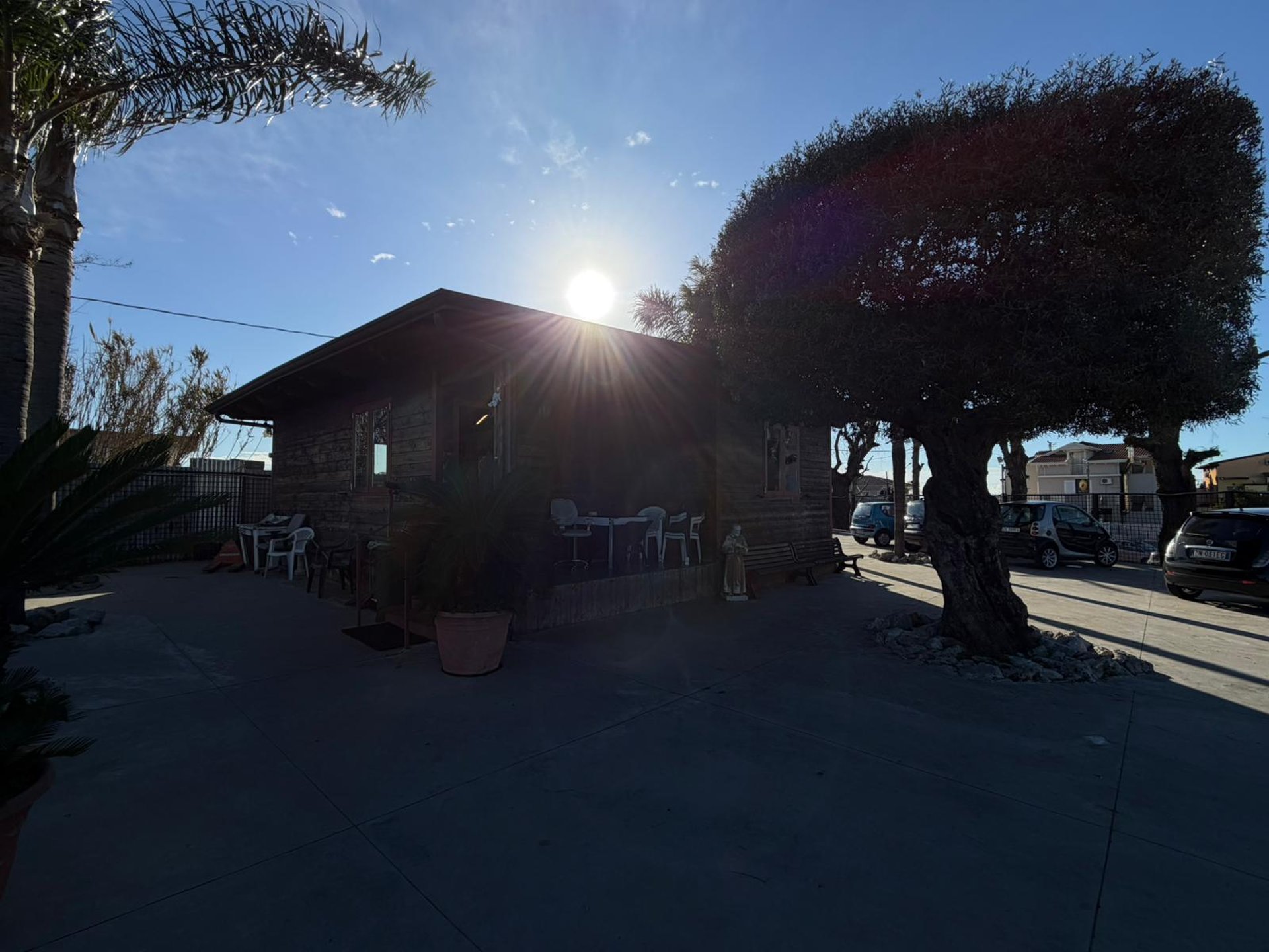 an abstract photo of a curved building with a blue sky in the background