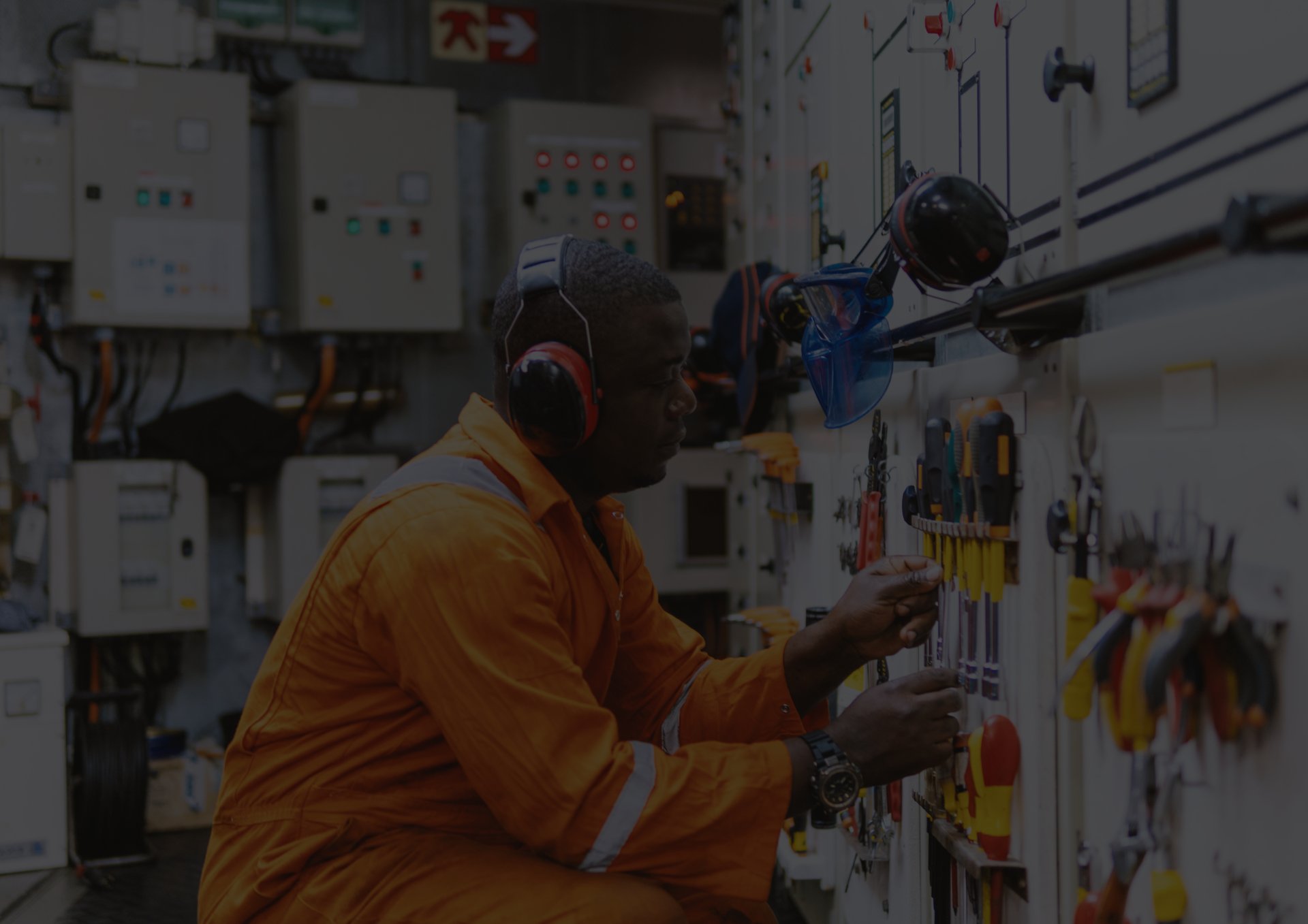 People are gathered near debris on a mountain road.