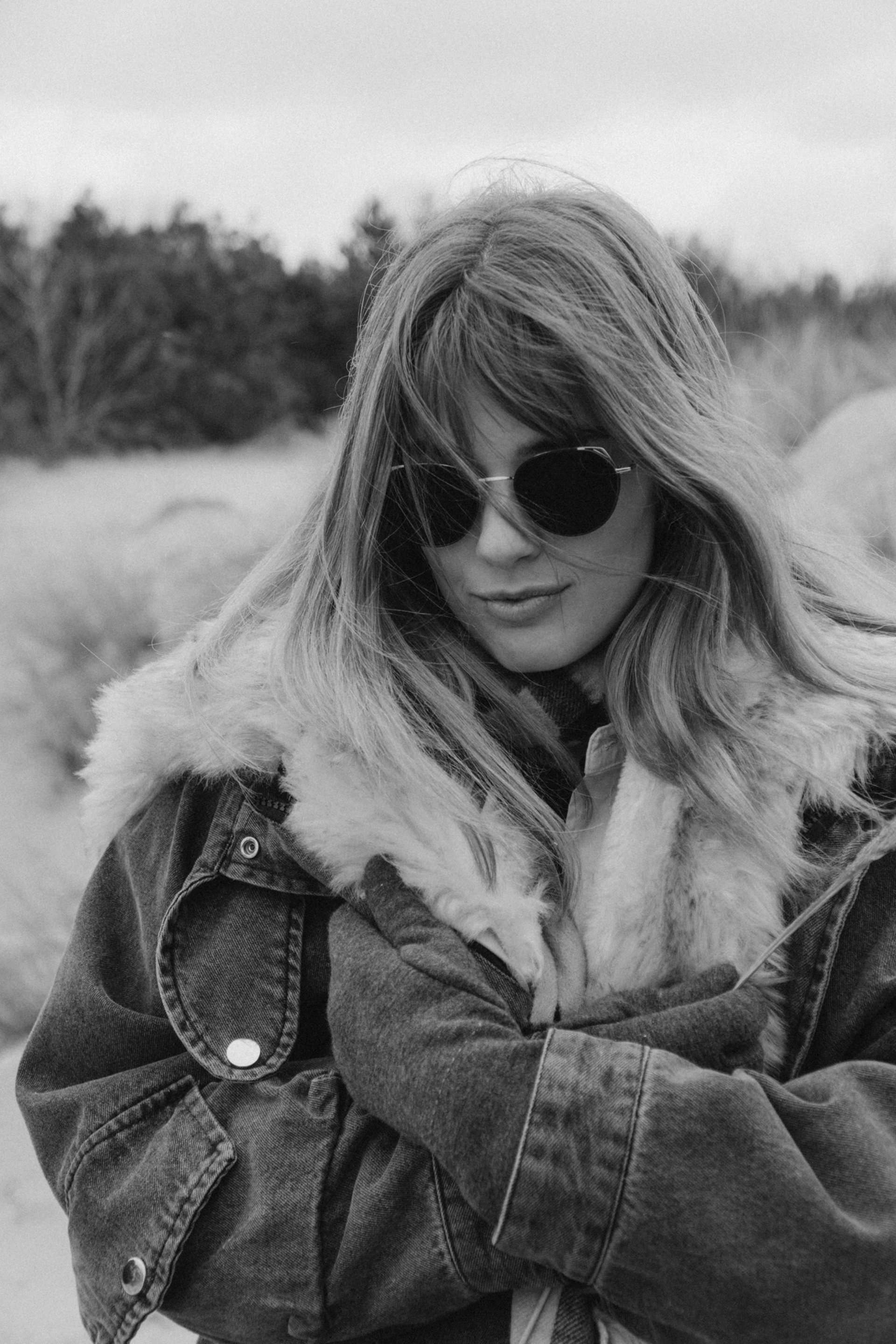 an abstract photo of a curved building with a blue sky in the background