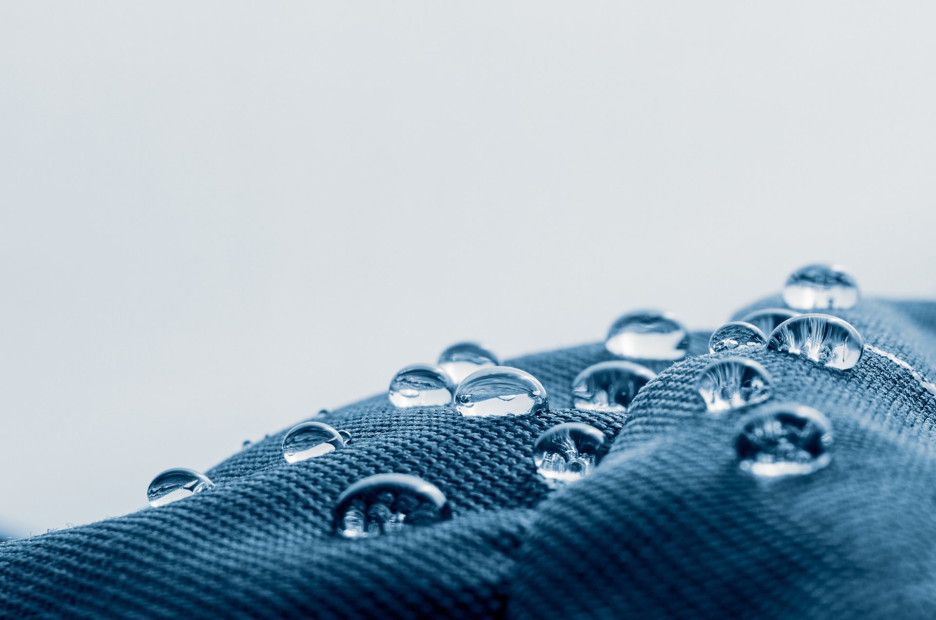 photography of white treadle on brown wooden rack
