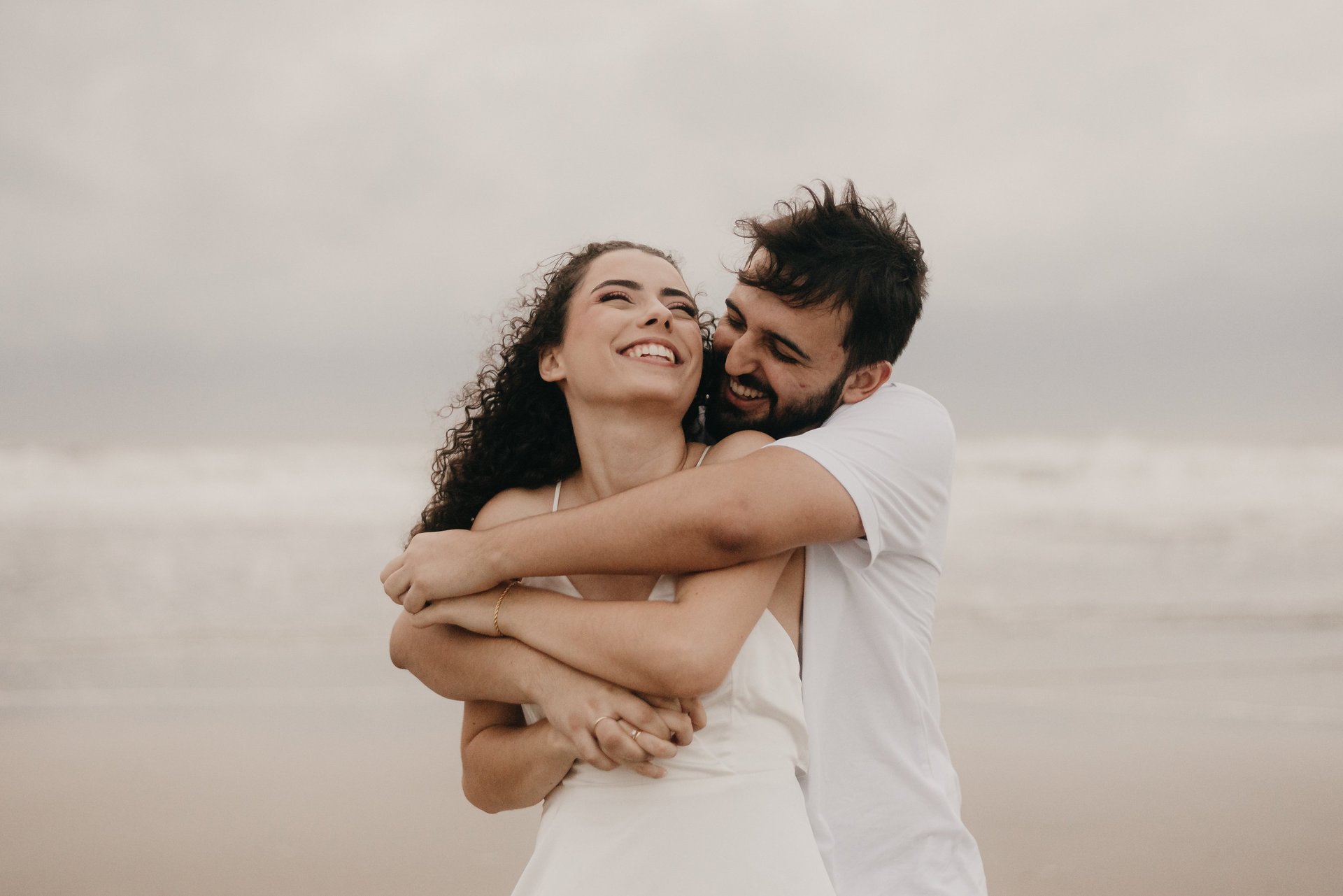 couple wearing silver-colored rings