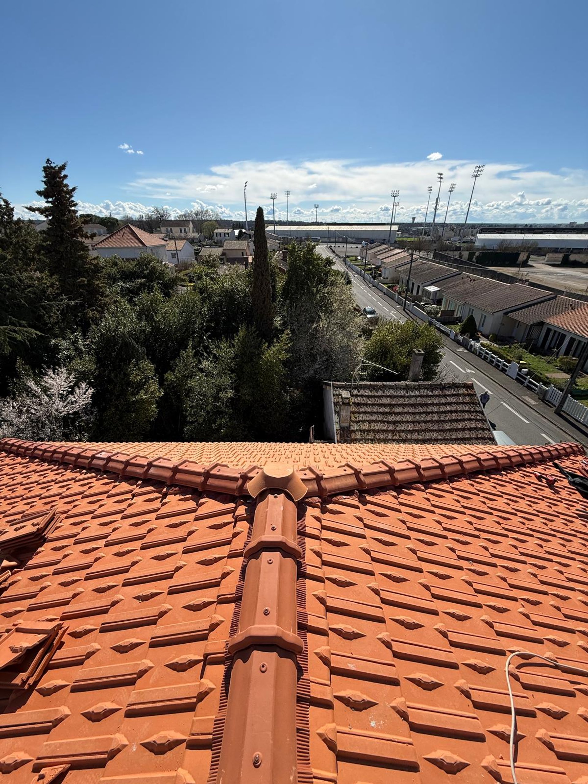 a person wearing blue gloves and holding a hammer
