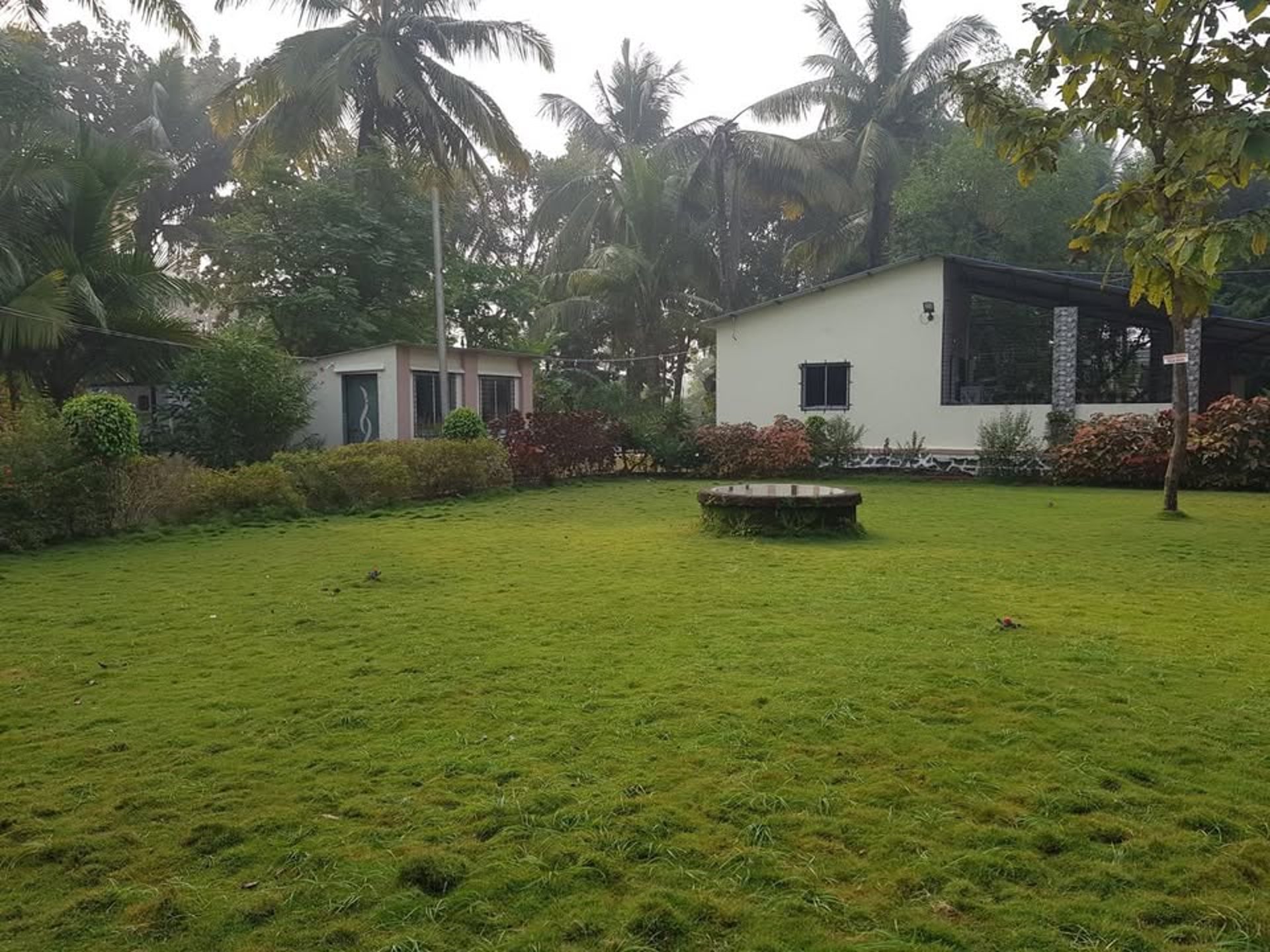 a bedroom with two beds and a balcony