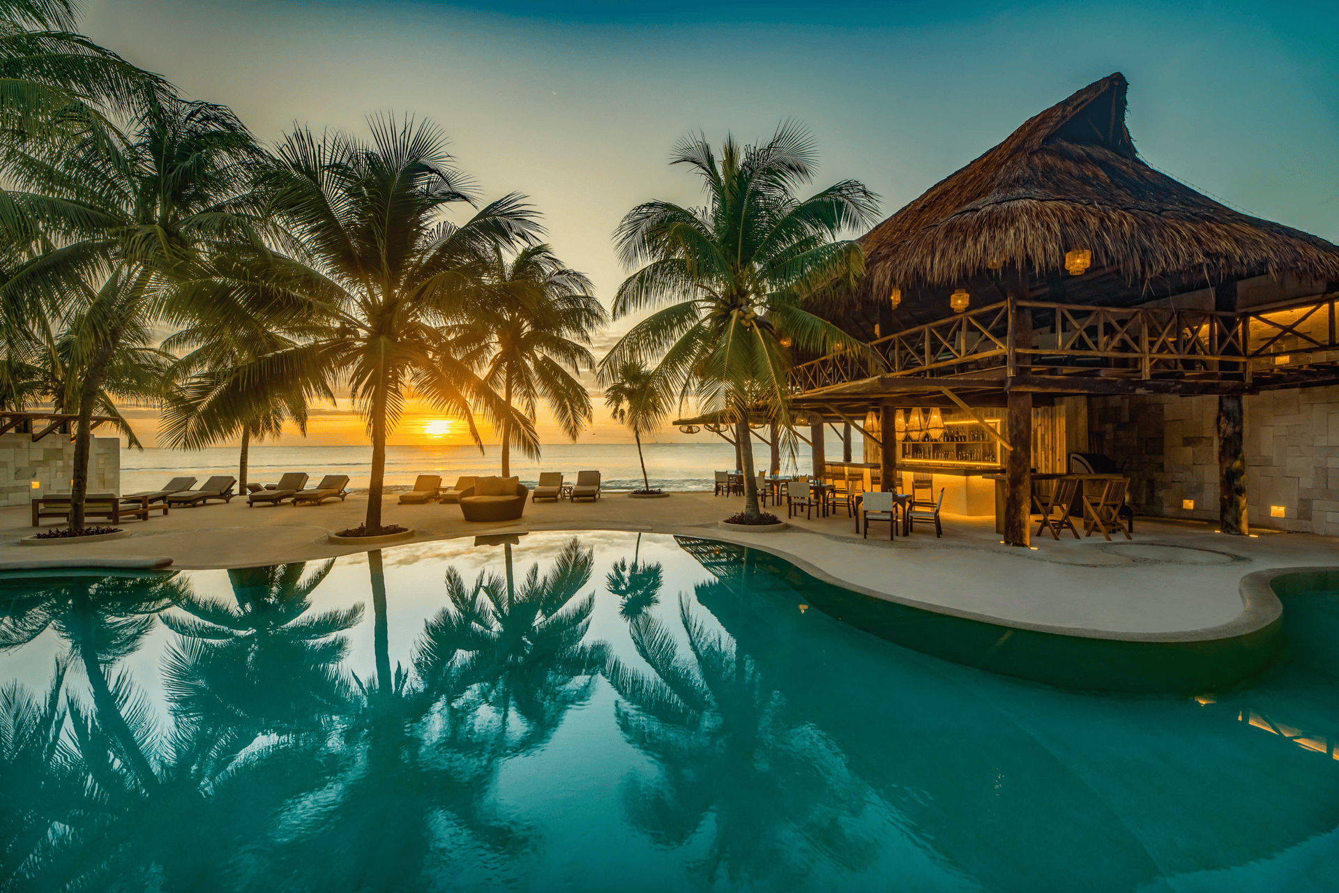 an abstract photo of a curved building with a blue sky in the background