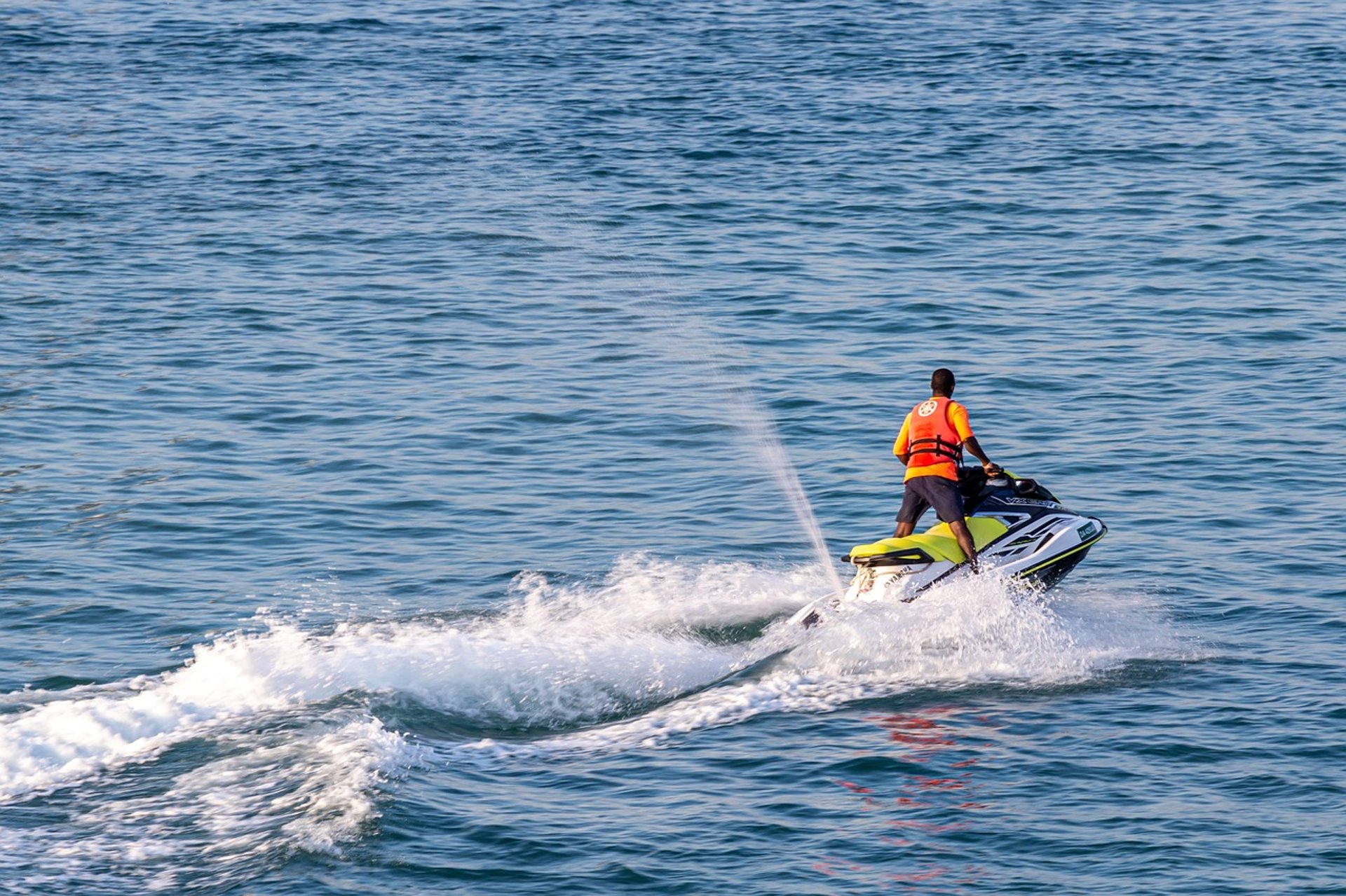 photo of people riding power boat