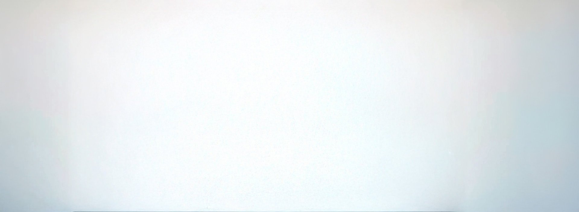 person in black suit jacket holding white tablet computer