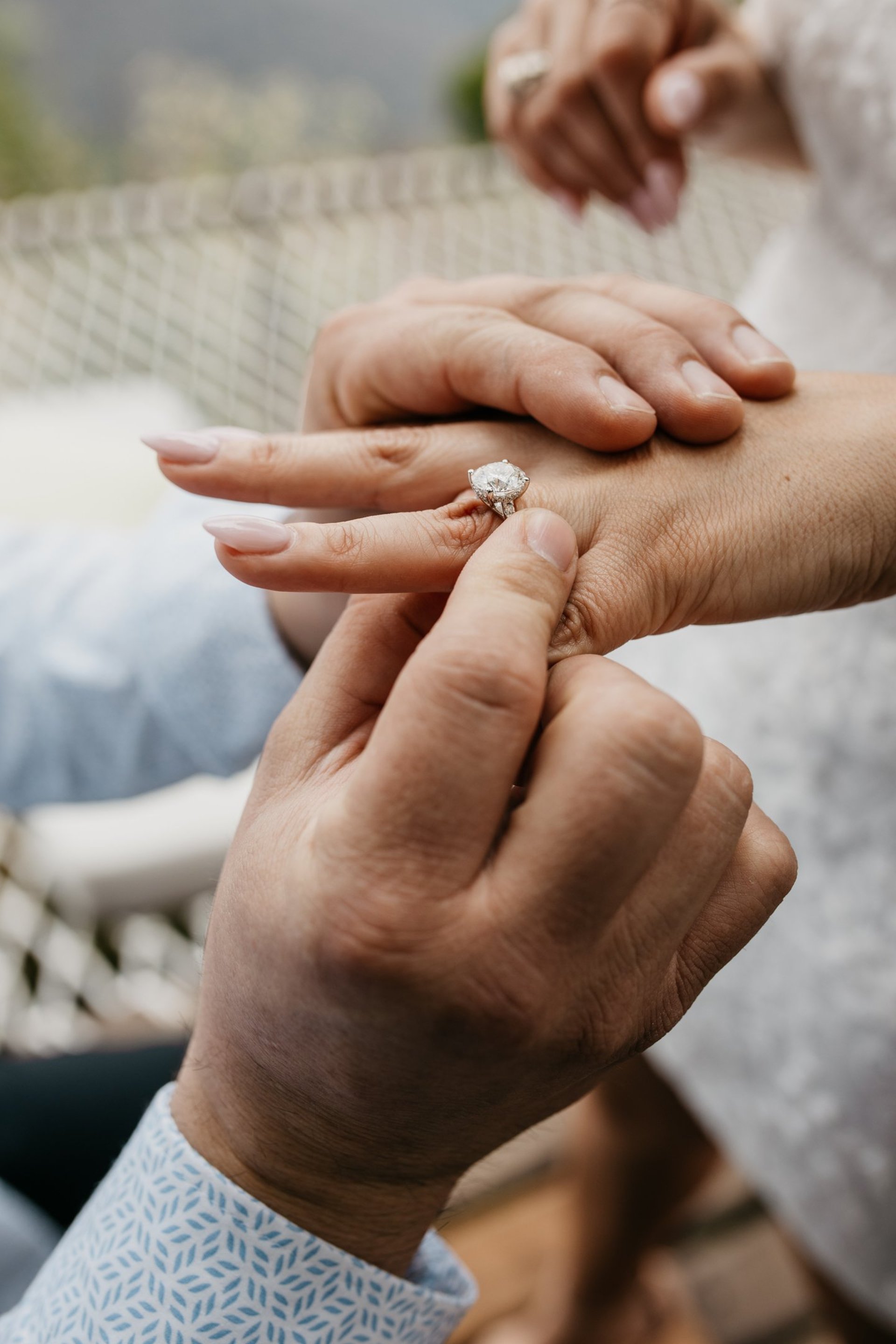 couple wearing silver-colored rings