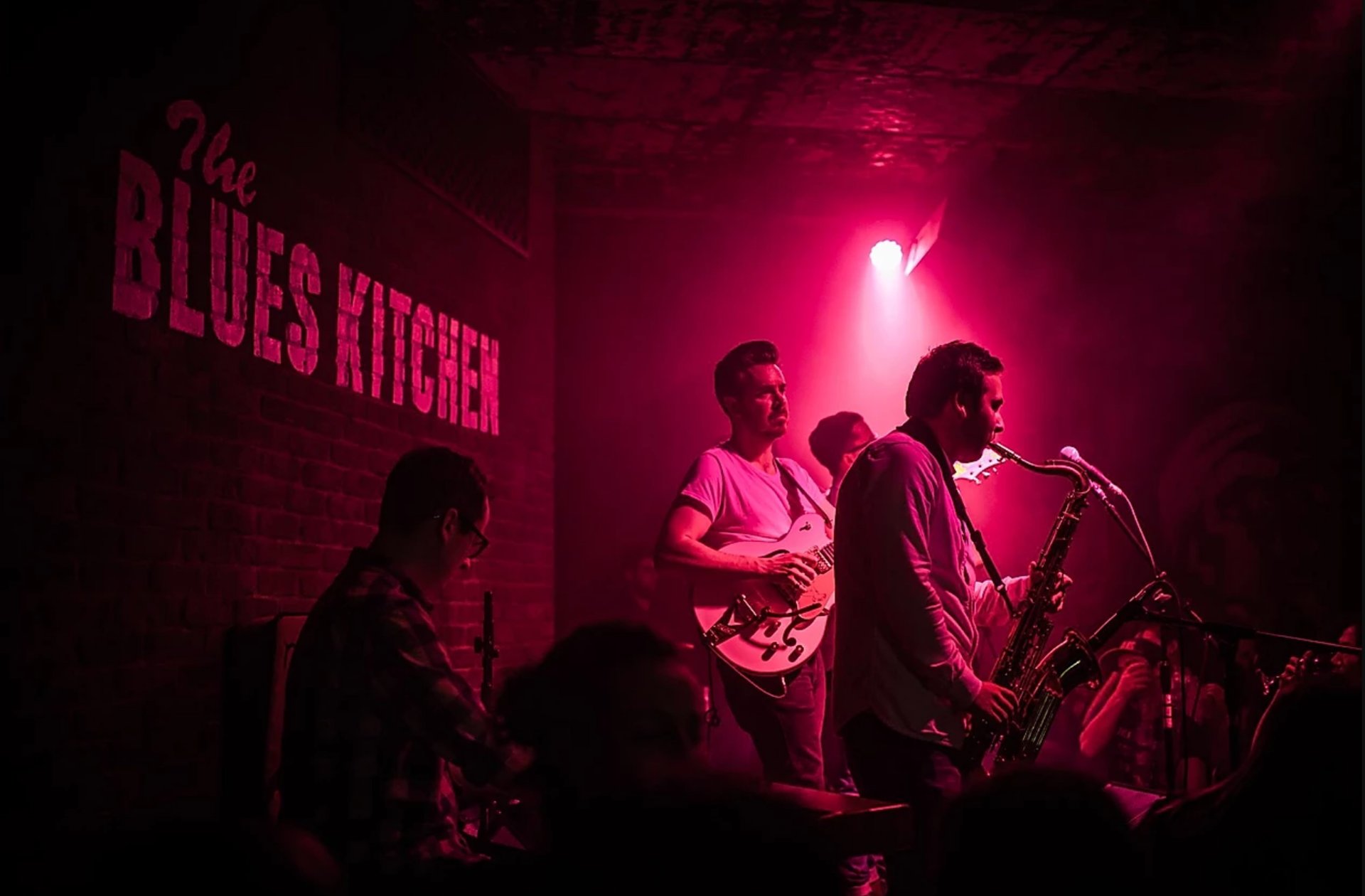 man and woman playing guitars