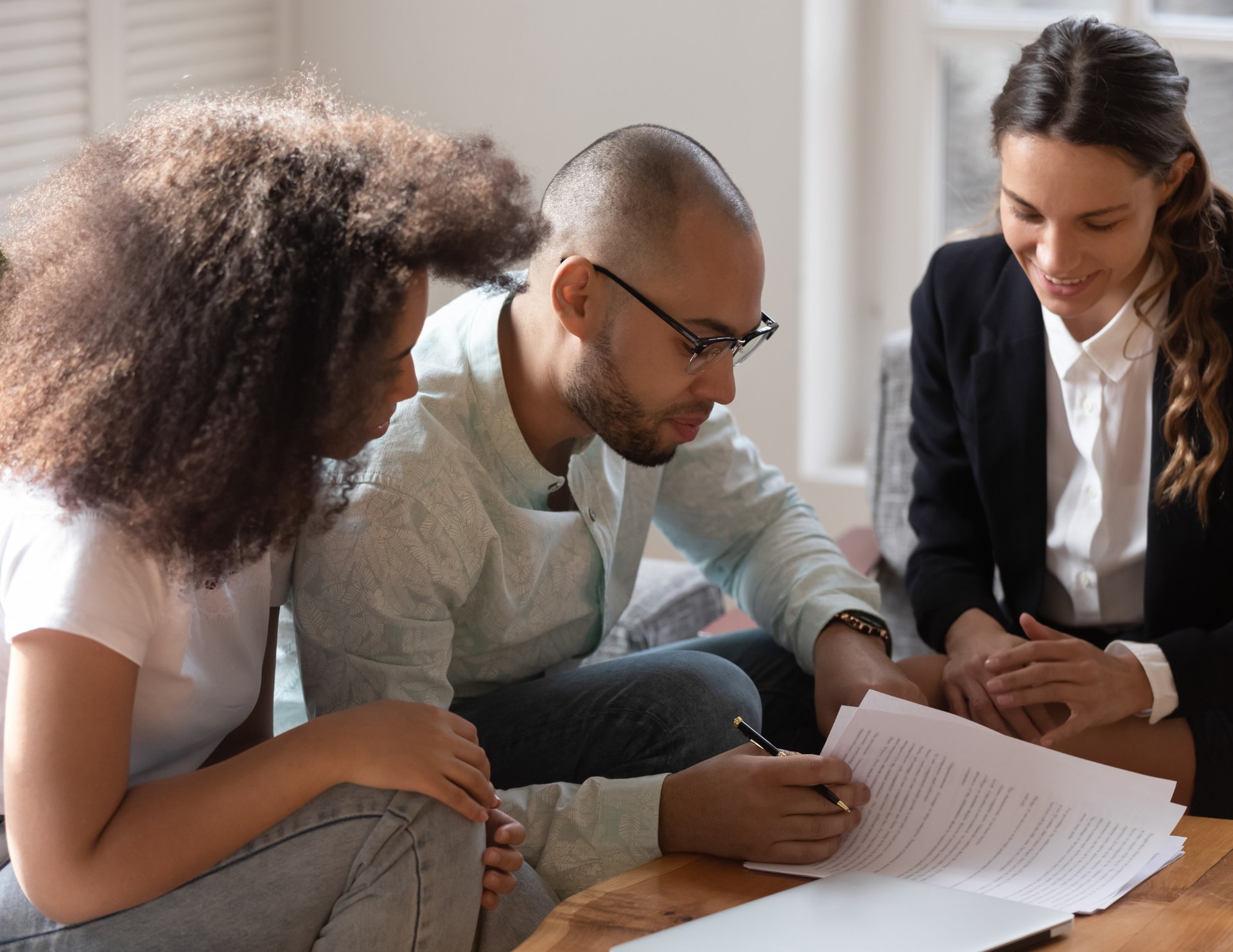 an abstract photo of a curved building with a blue sky in the background