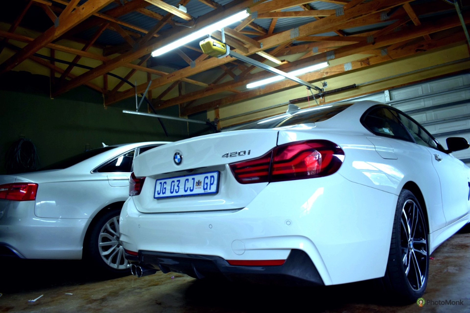 black bmw car with yellow and green light