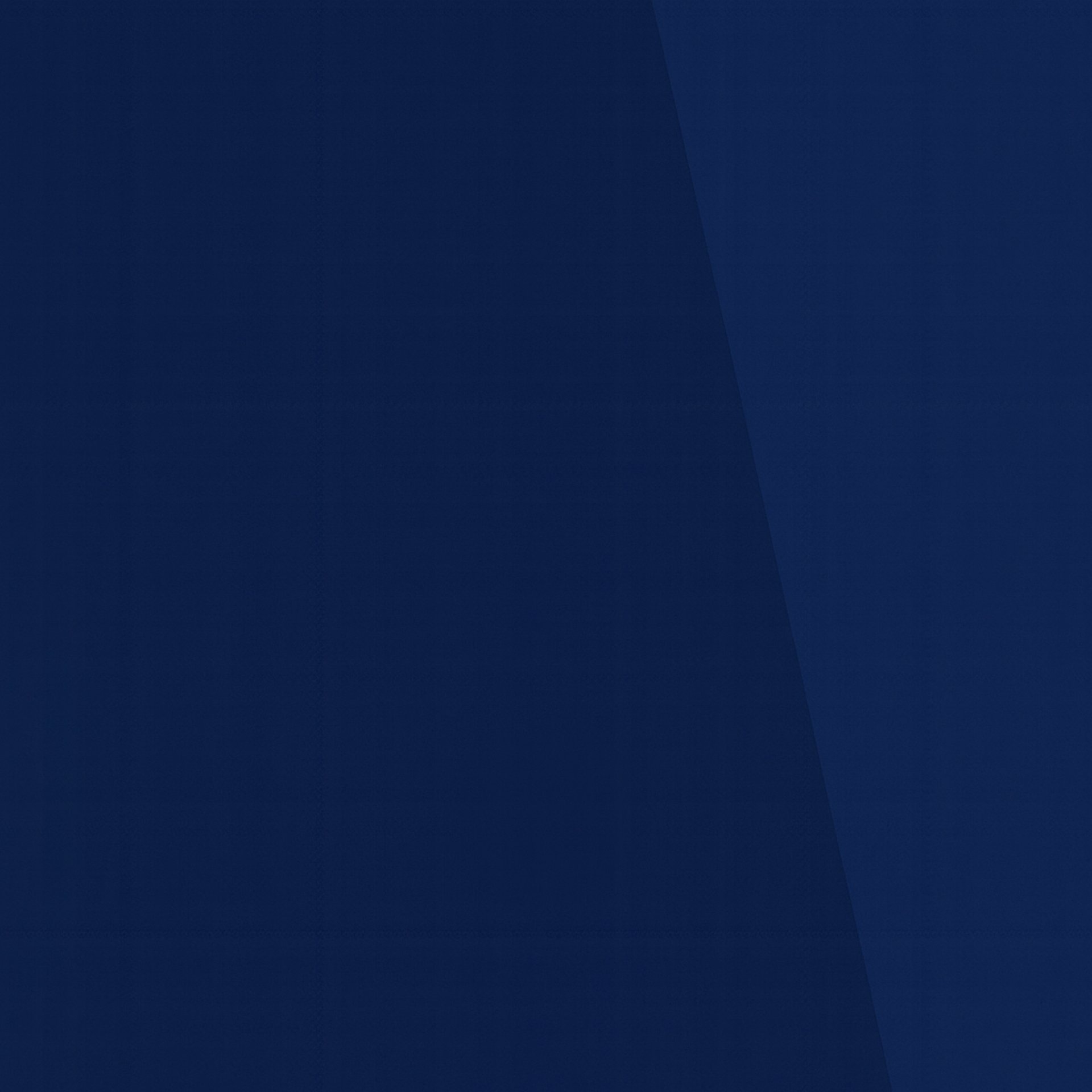 A wooden table topped with scrabble tiles spelling contact