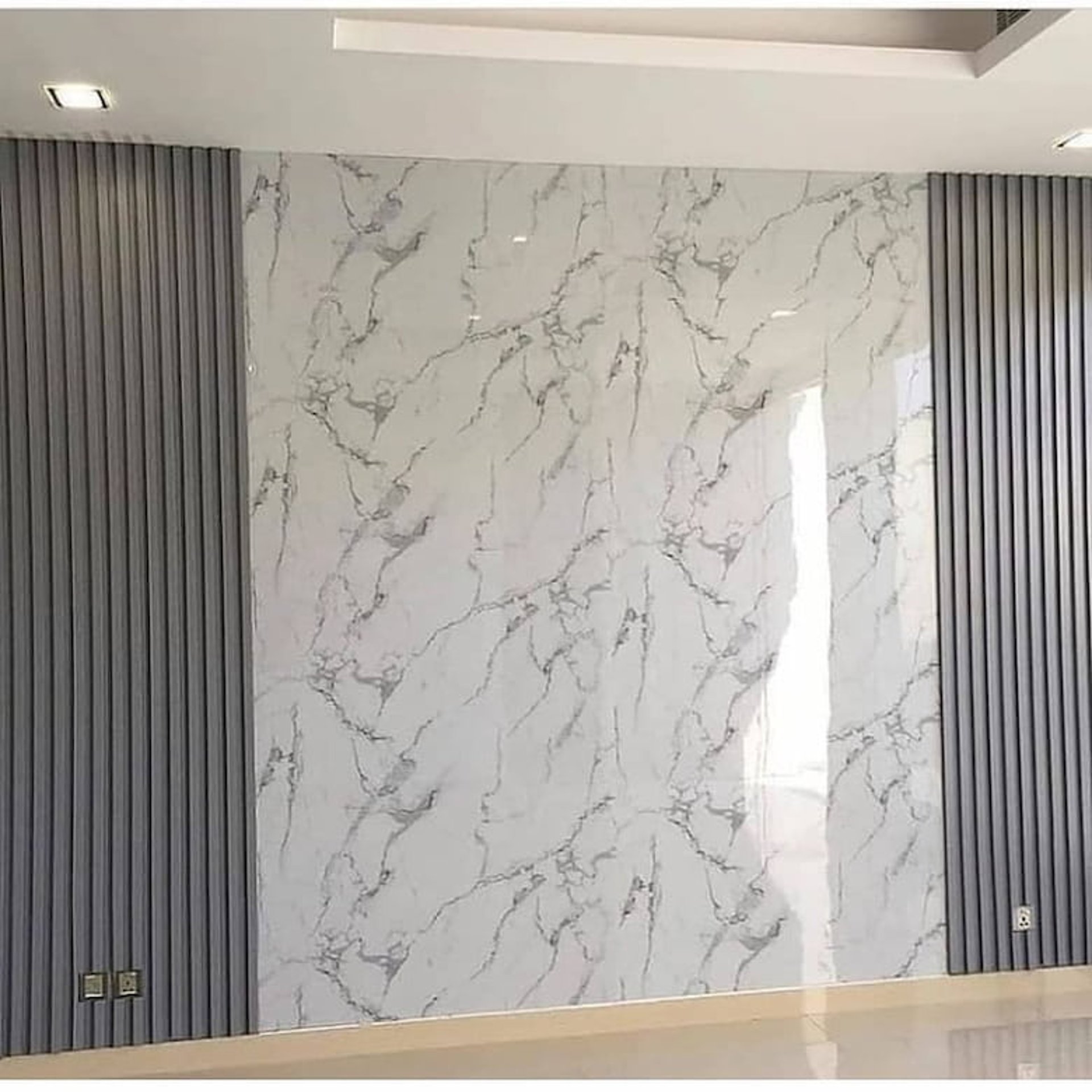 an abstract photo of a curved building with a blue sky in the background