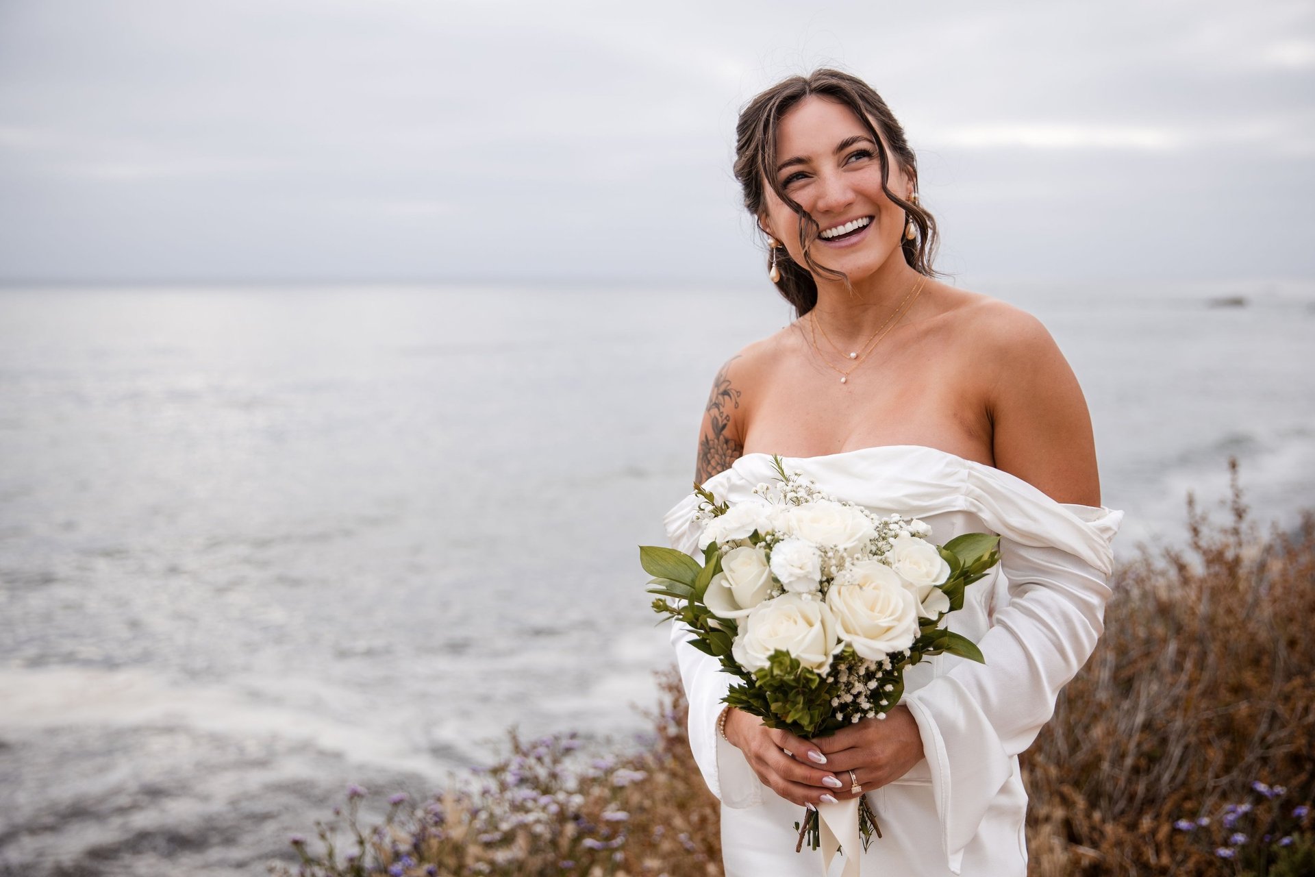 woman wearing yellow long-sleeved dress under white clouds and blue sky during daytime