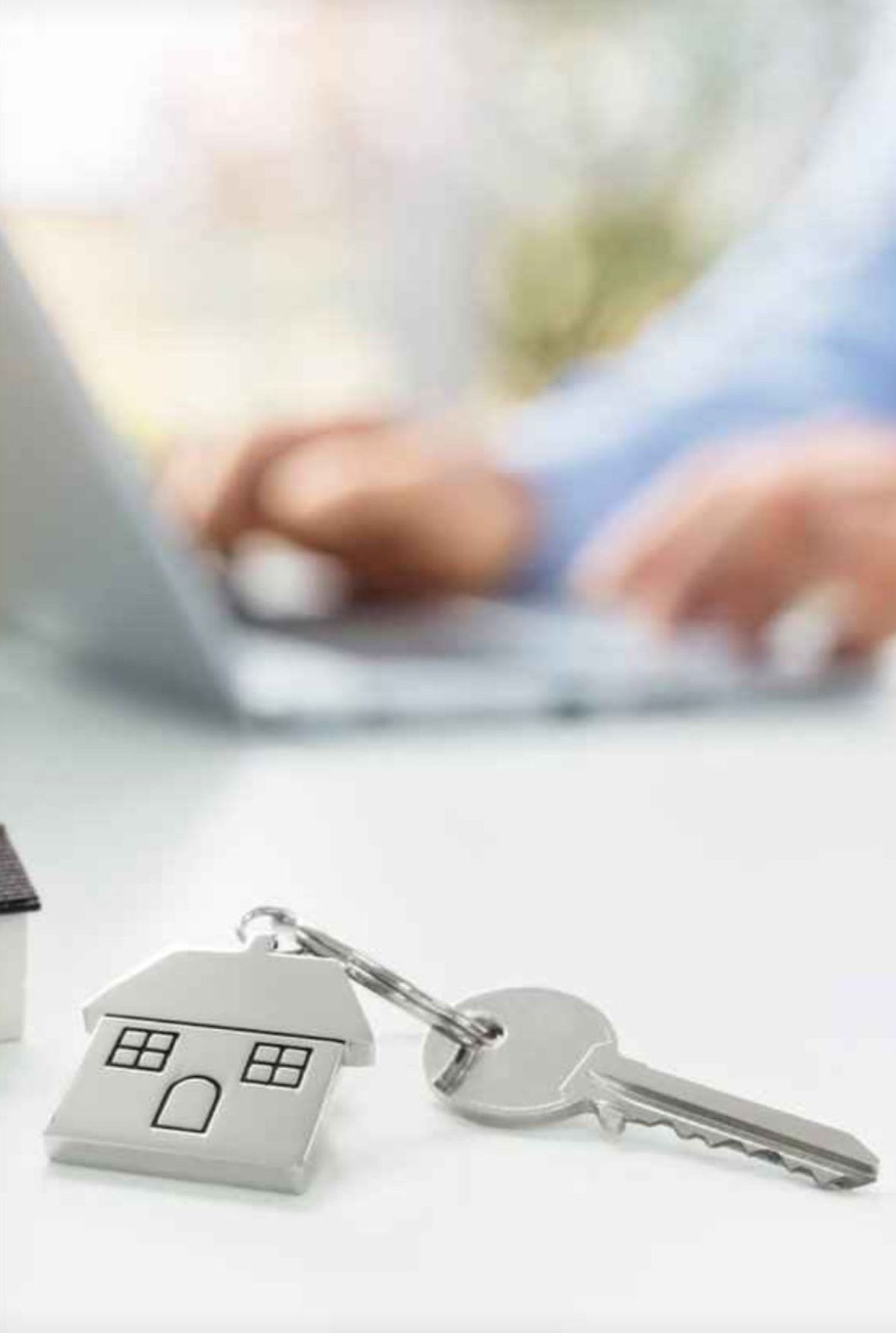 three small houses sitting on top of a piece of paper
