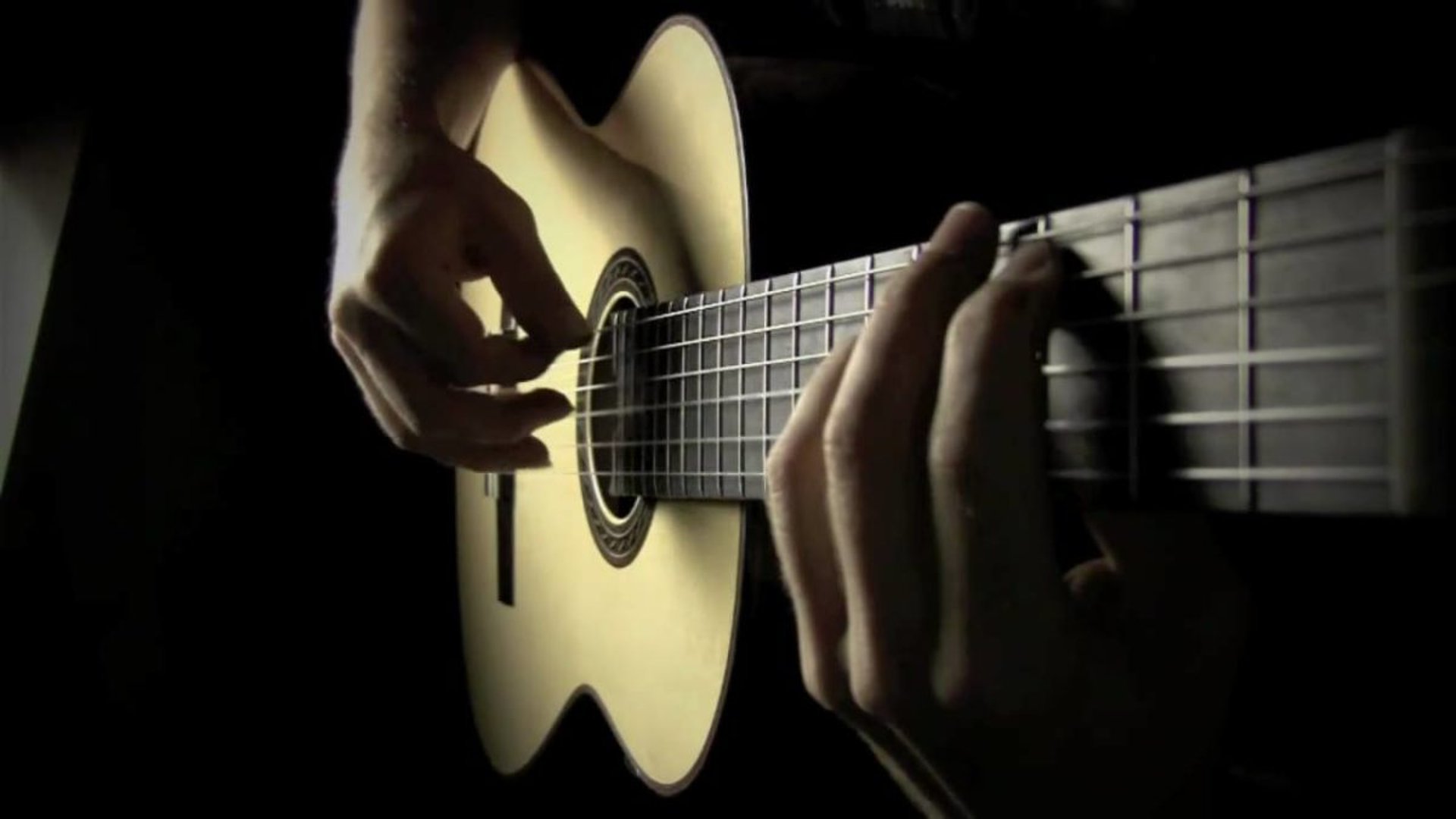 brown acoustic guitar on the street