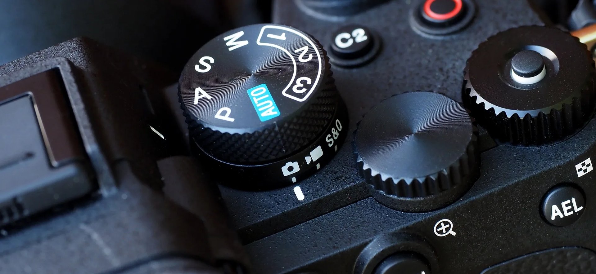 an abstract photo of a curved building with a blue sky in the background