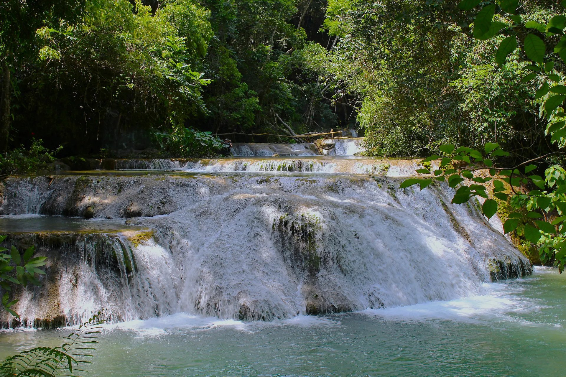 an abstract photo of a curved building with a blue sky in the background
