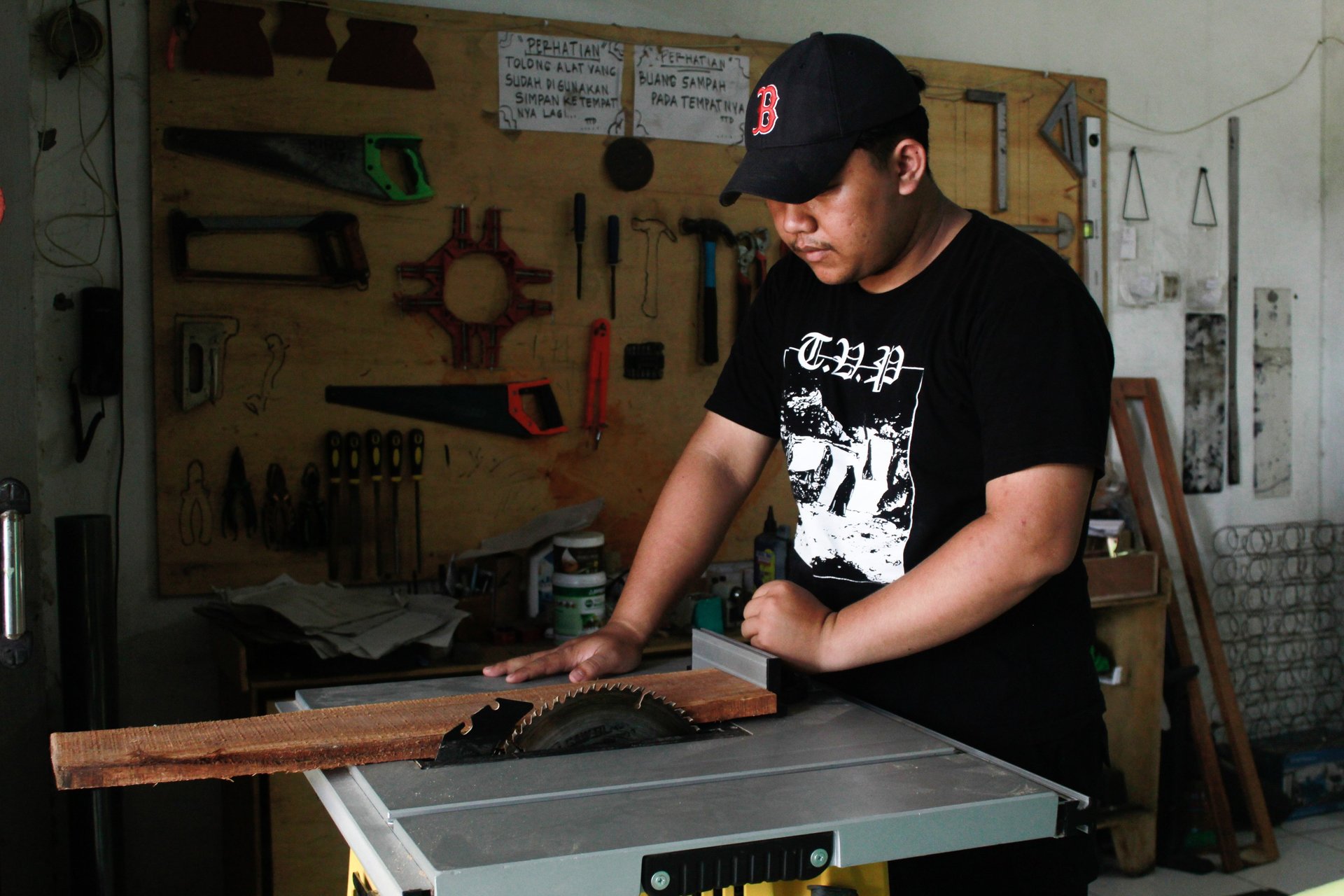 A man working on a piece of wood