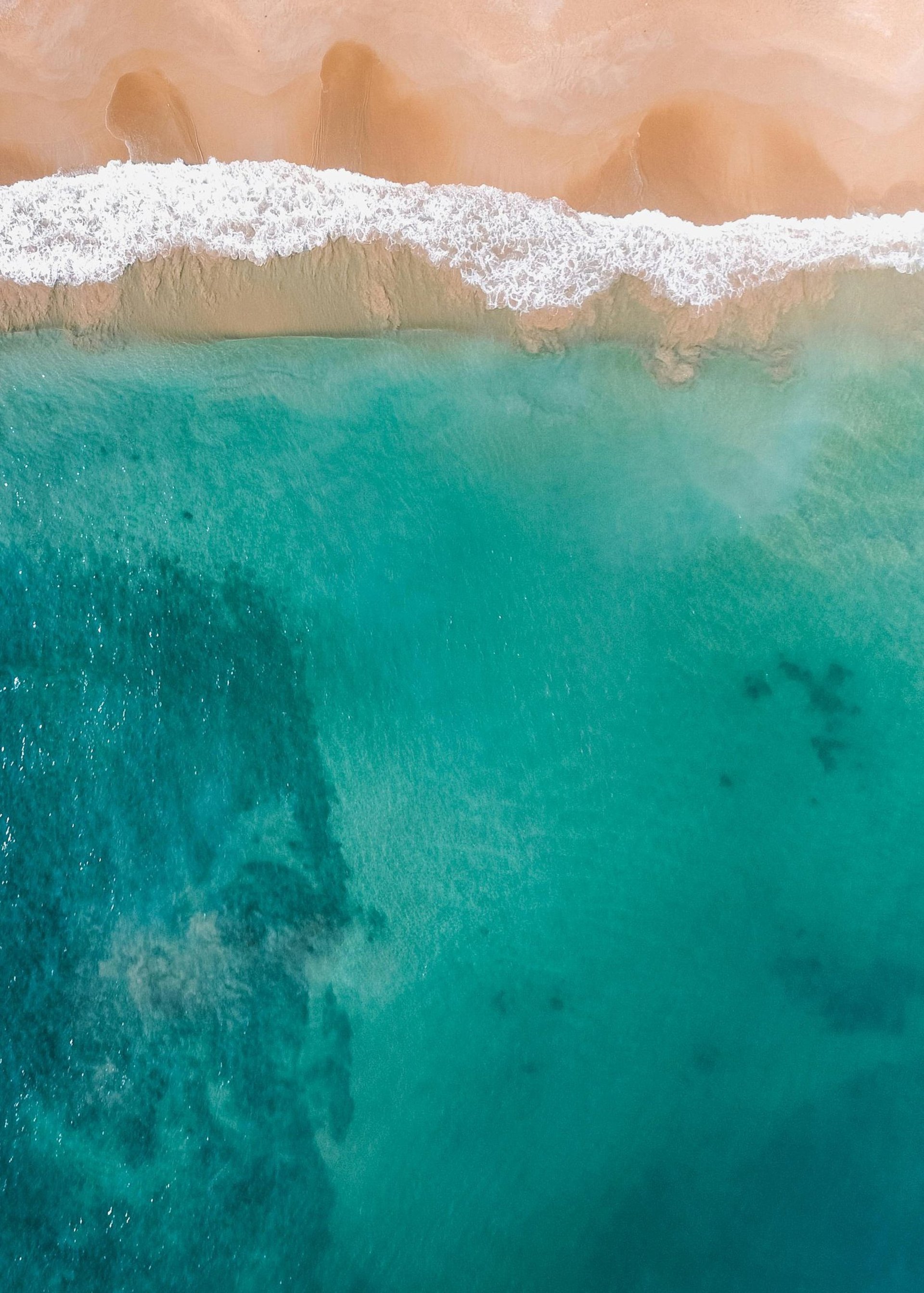 an abstract photo of a curved building with a blue sky in the background