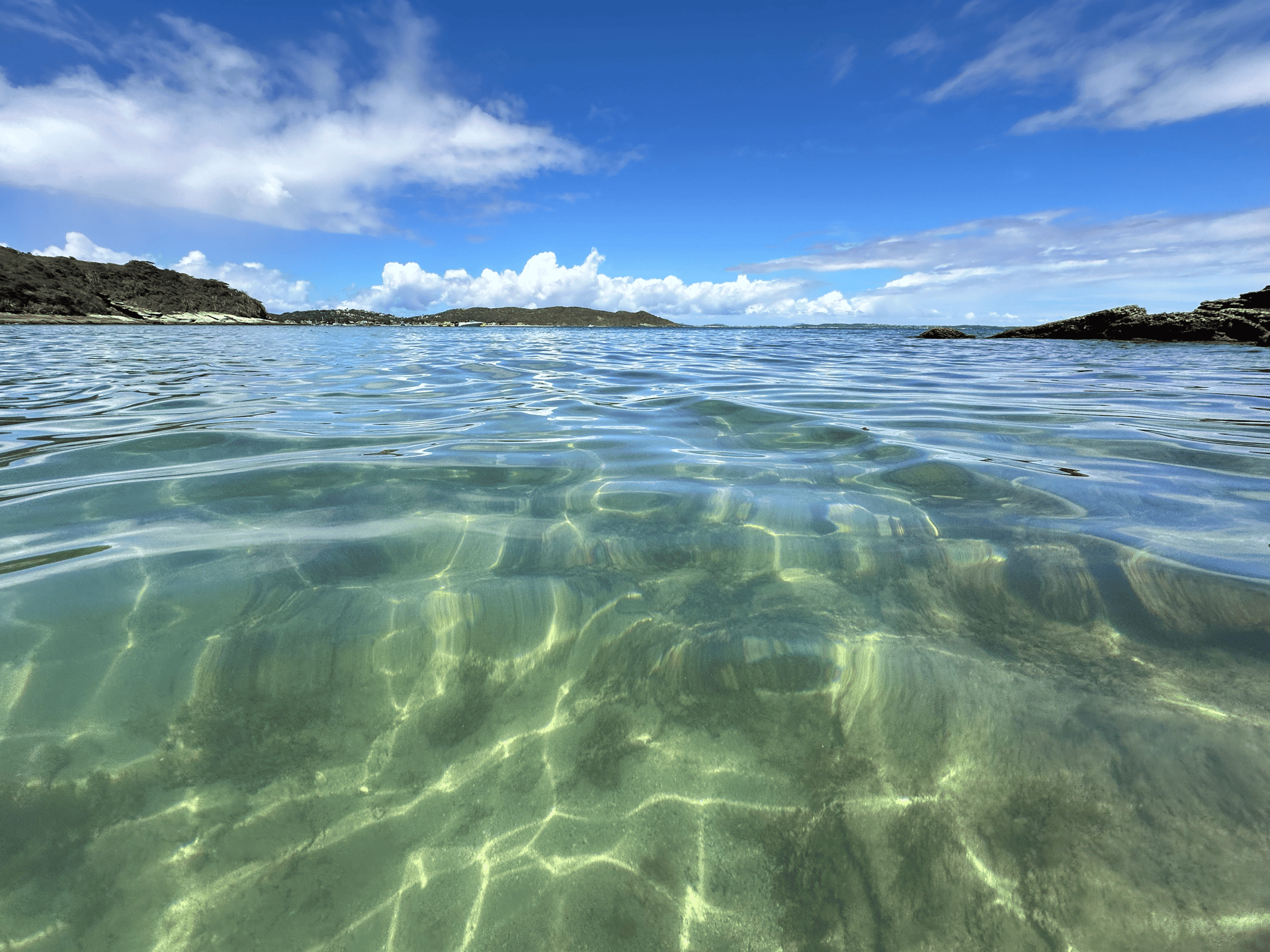 an abstract photo of a curved building with a blue sky in the background