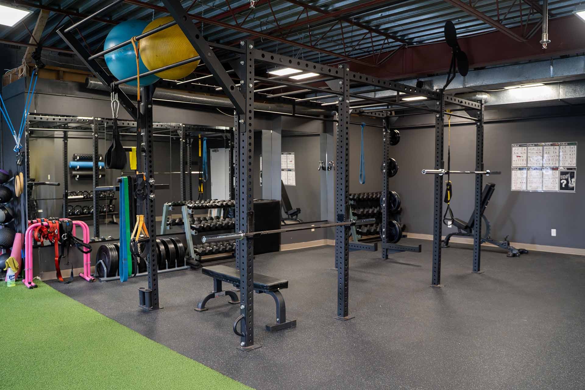 a gym with rows of exercise equipment