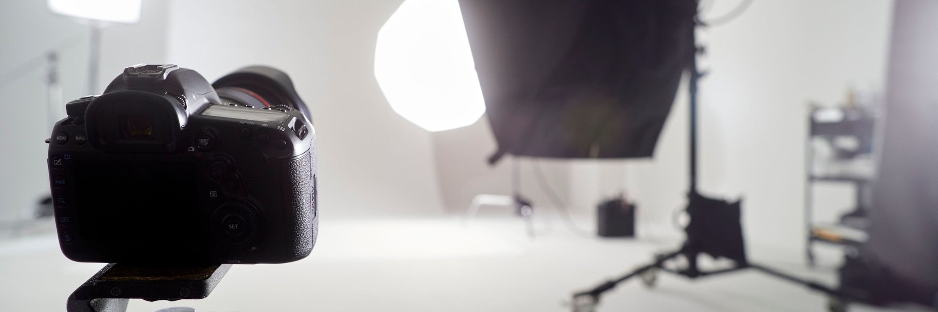 Camera setup in a photography studio with lighting — professional space for photography classes..