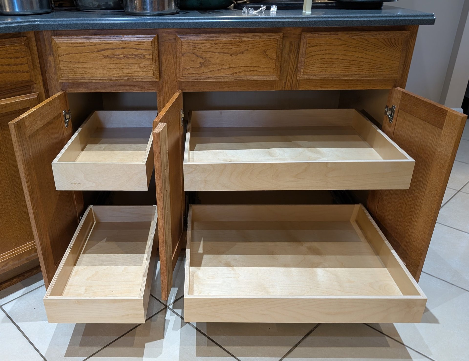 Pull out shelf installation in two kitchen cabinets.
