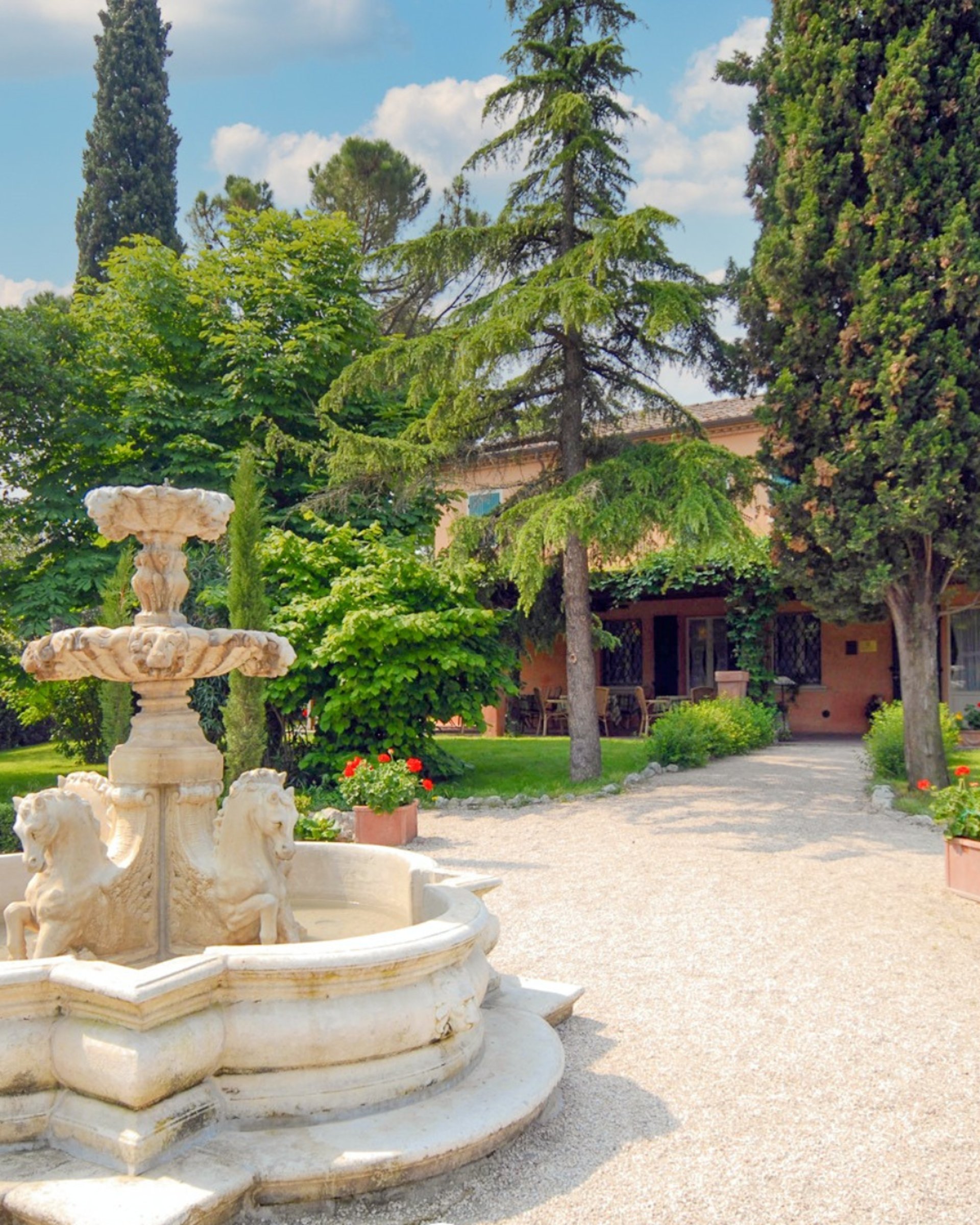 an abstract photo of a curved building with a blue sky in the background