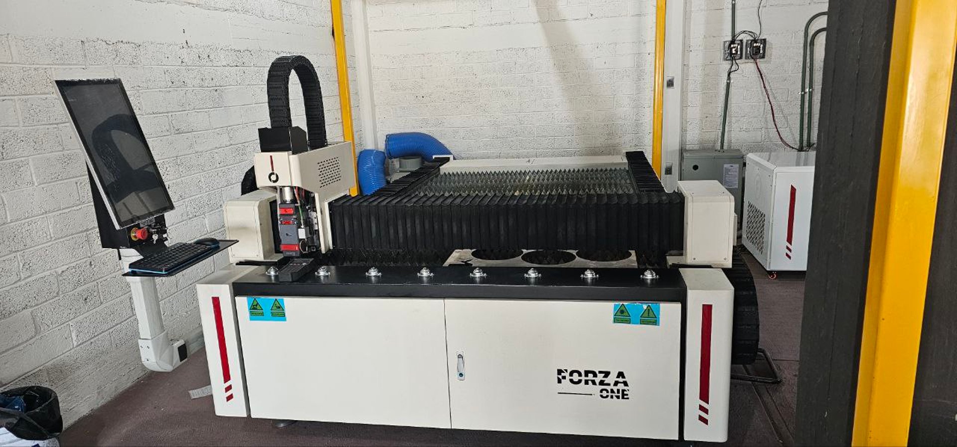 A large machine in a large building with lots of windows