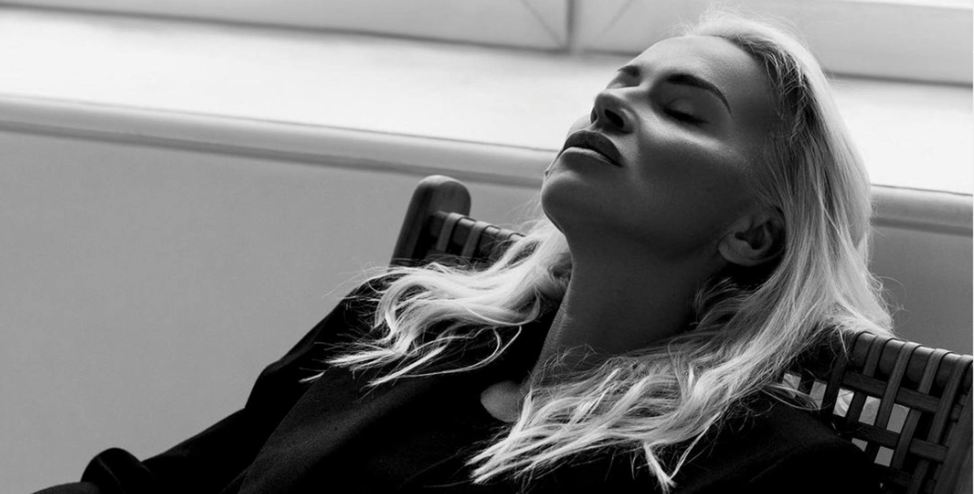 an abstract photo of a curved building with a blue sky in the background