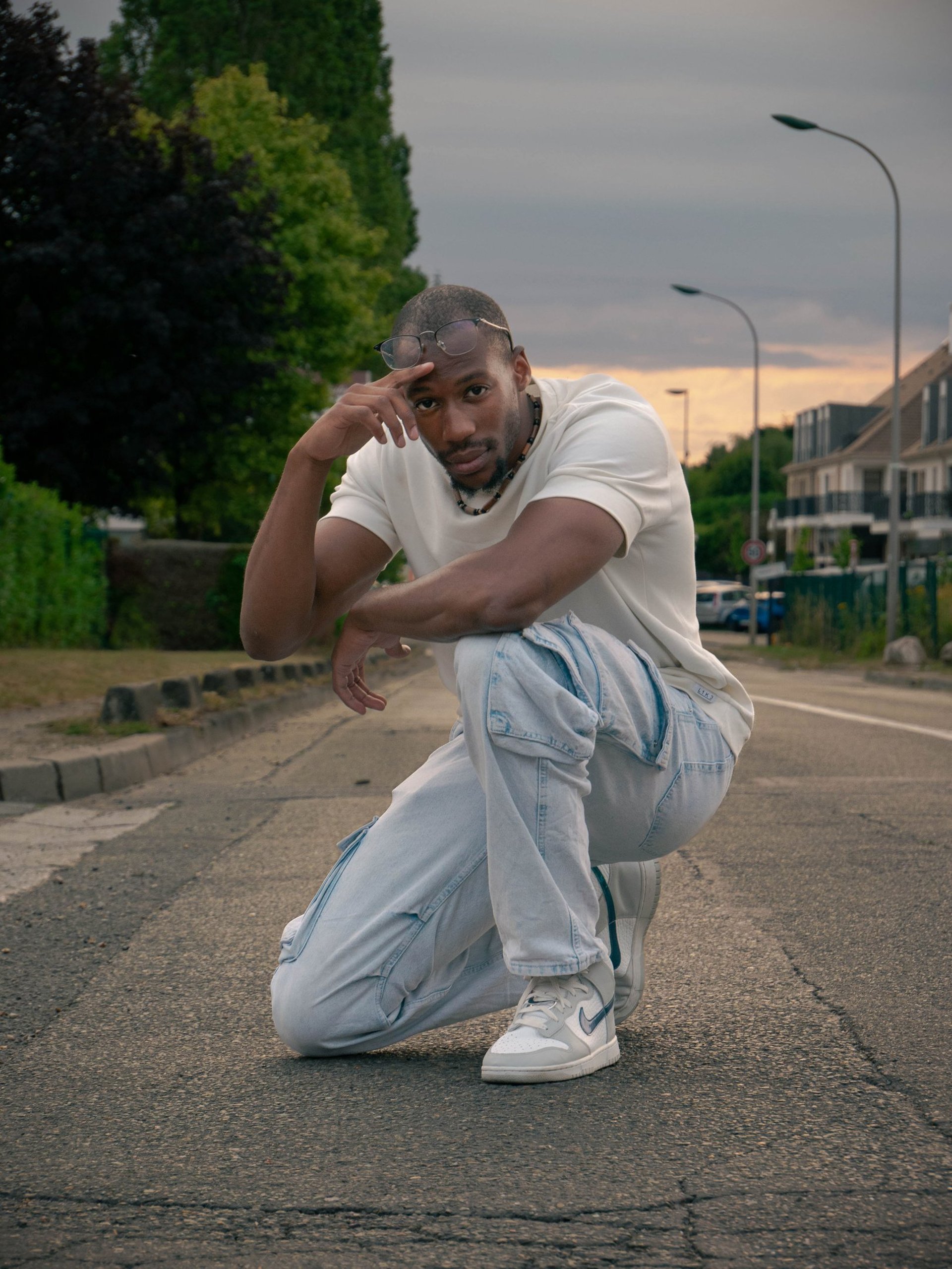 woman wearing yellow long-sleeved dress under white clouds and blue sky during daytime