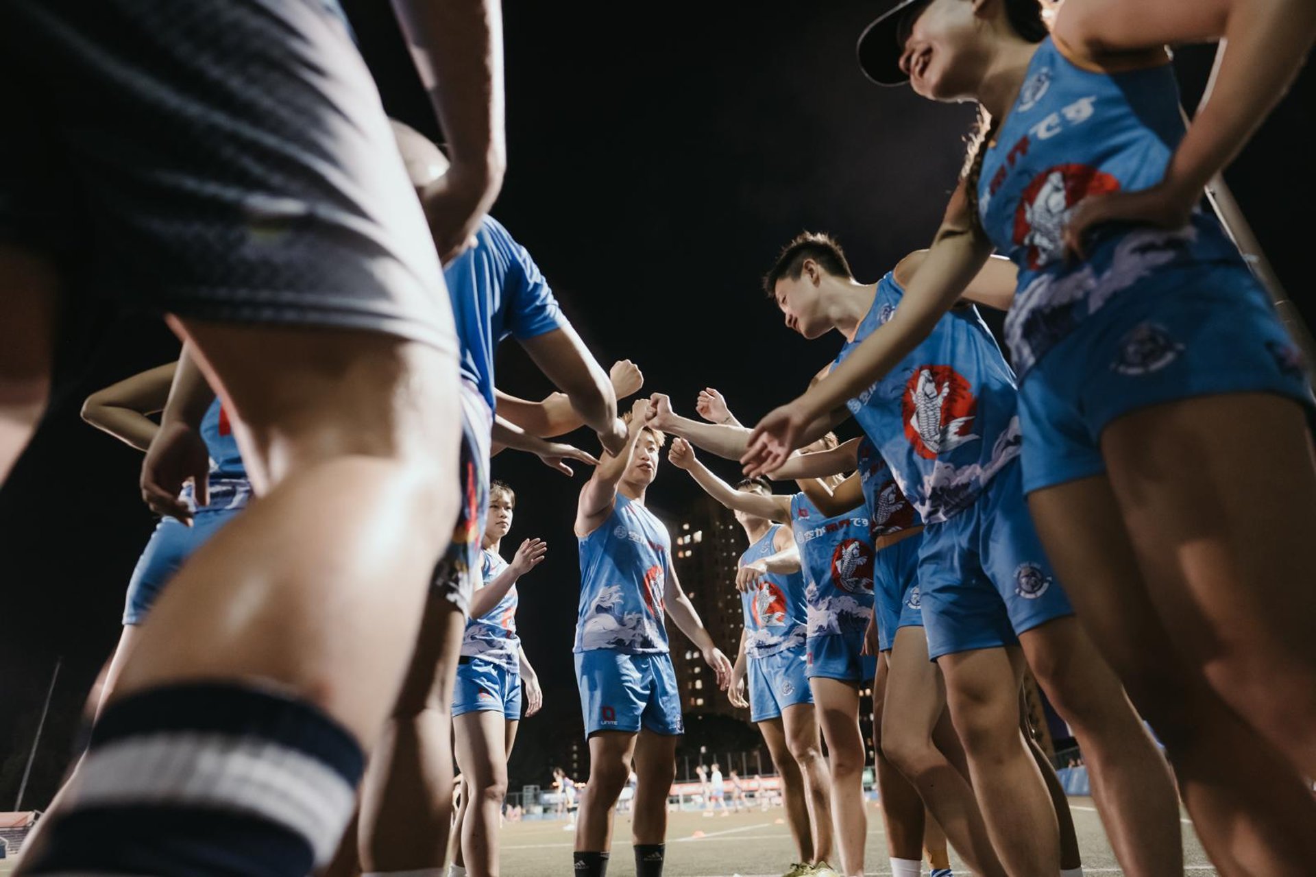 an abstract photo of a curved building with a blue sky in the background