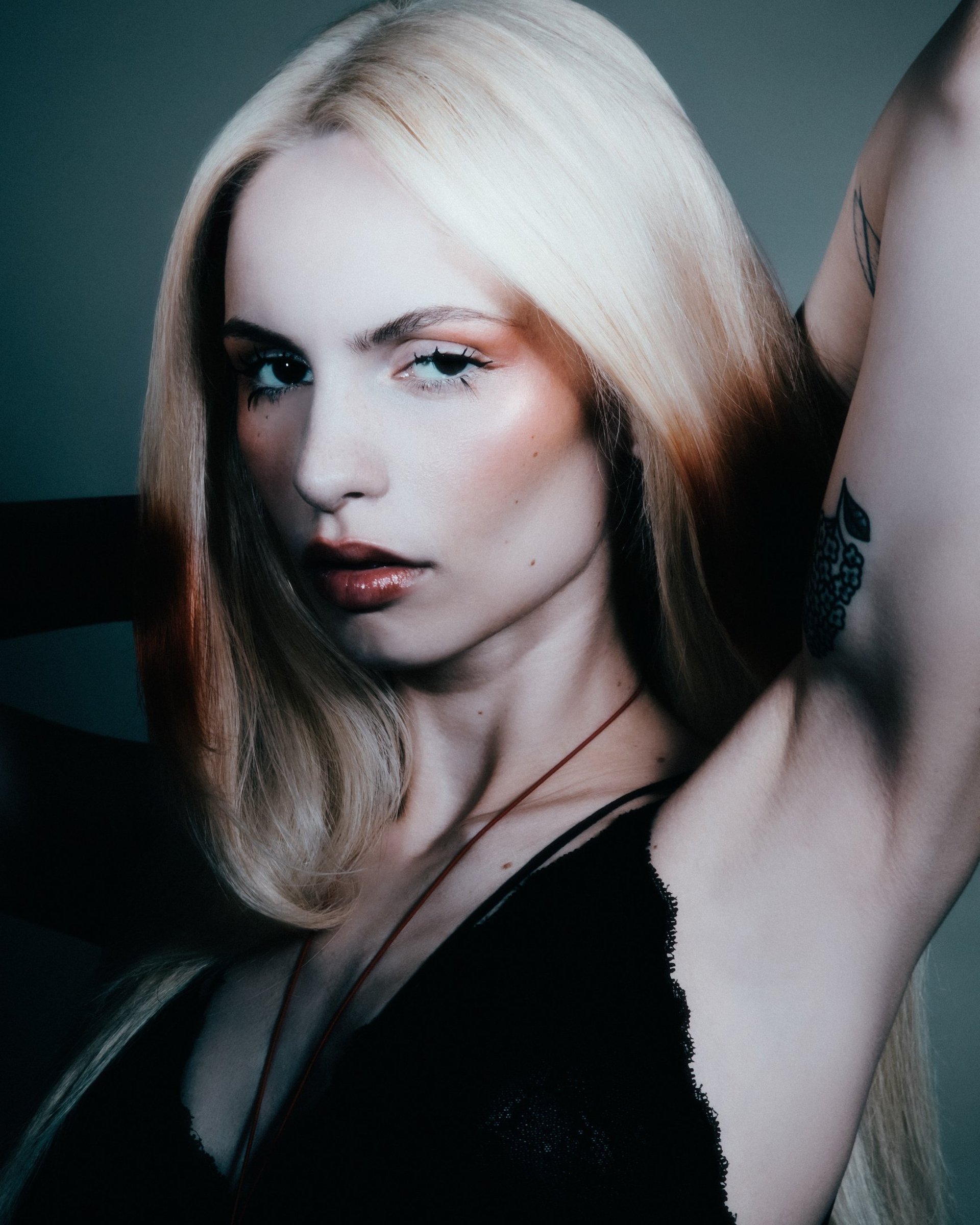 an abstract photo of a curved building with a blue sky in the background