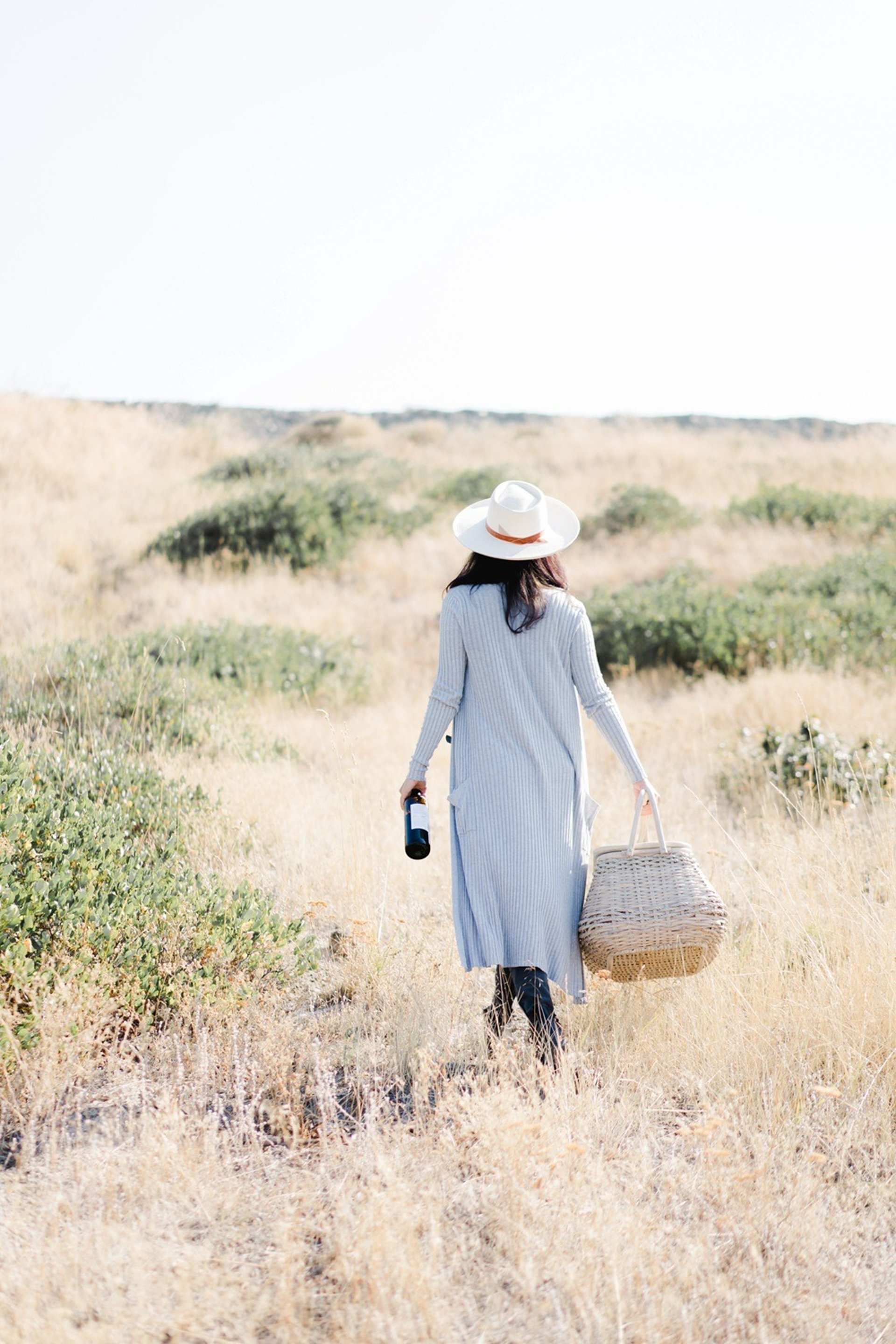 person wearing grey knit sweater