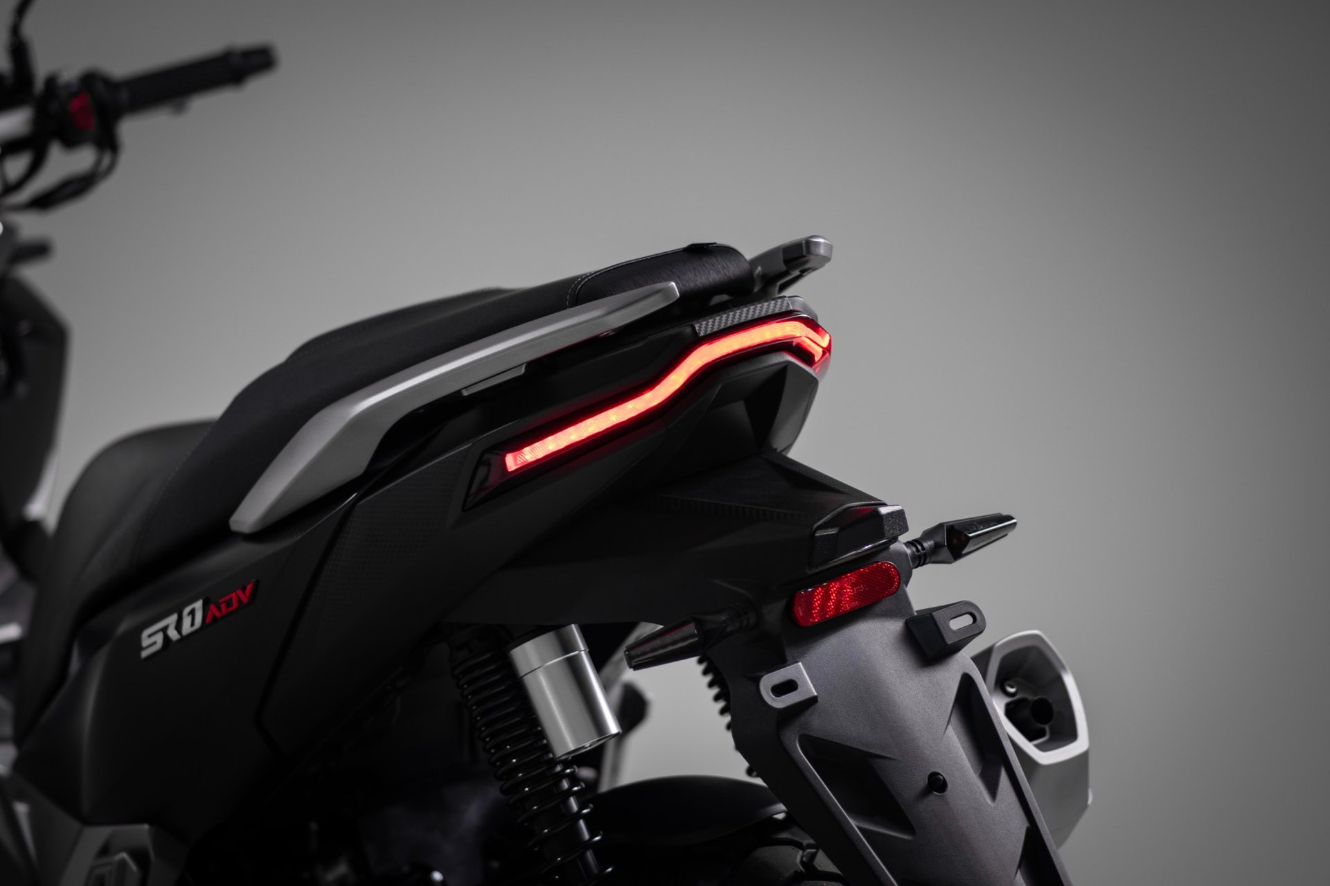 an abstract photo of a curved building with a blue sky in the background