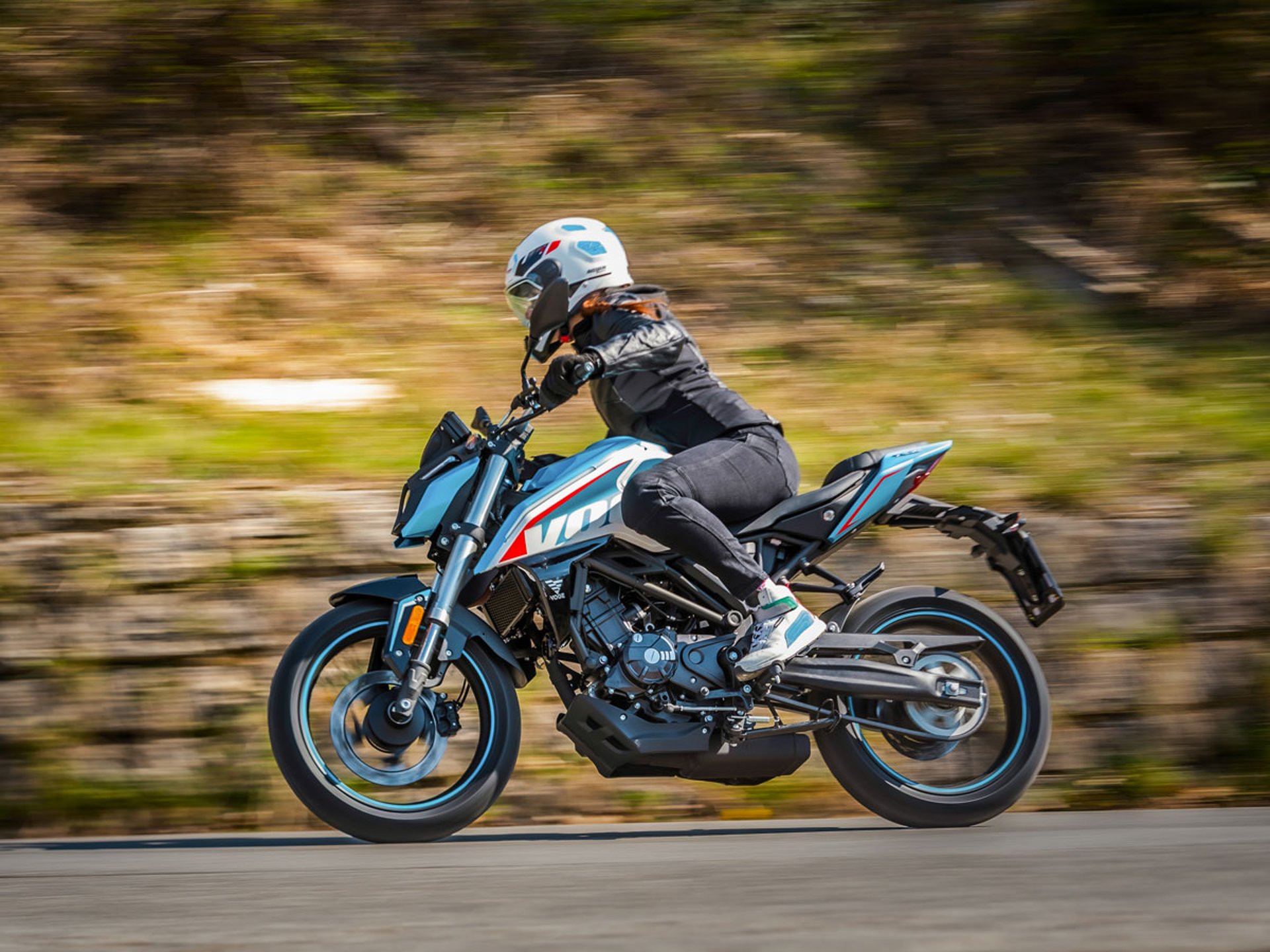 an abstract photo of a curved building with a blue sky in the background