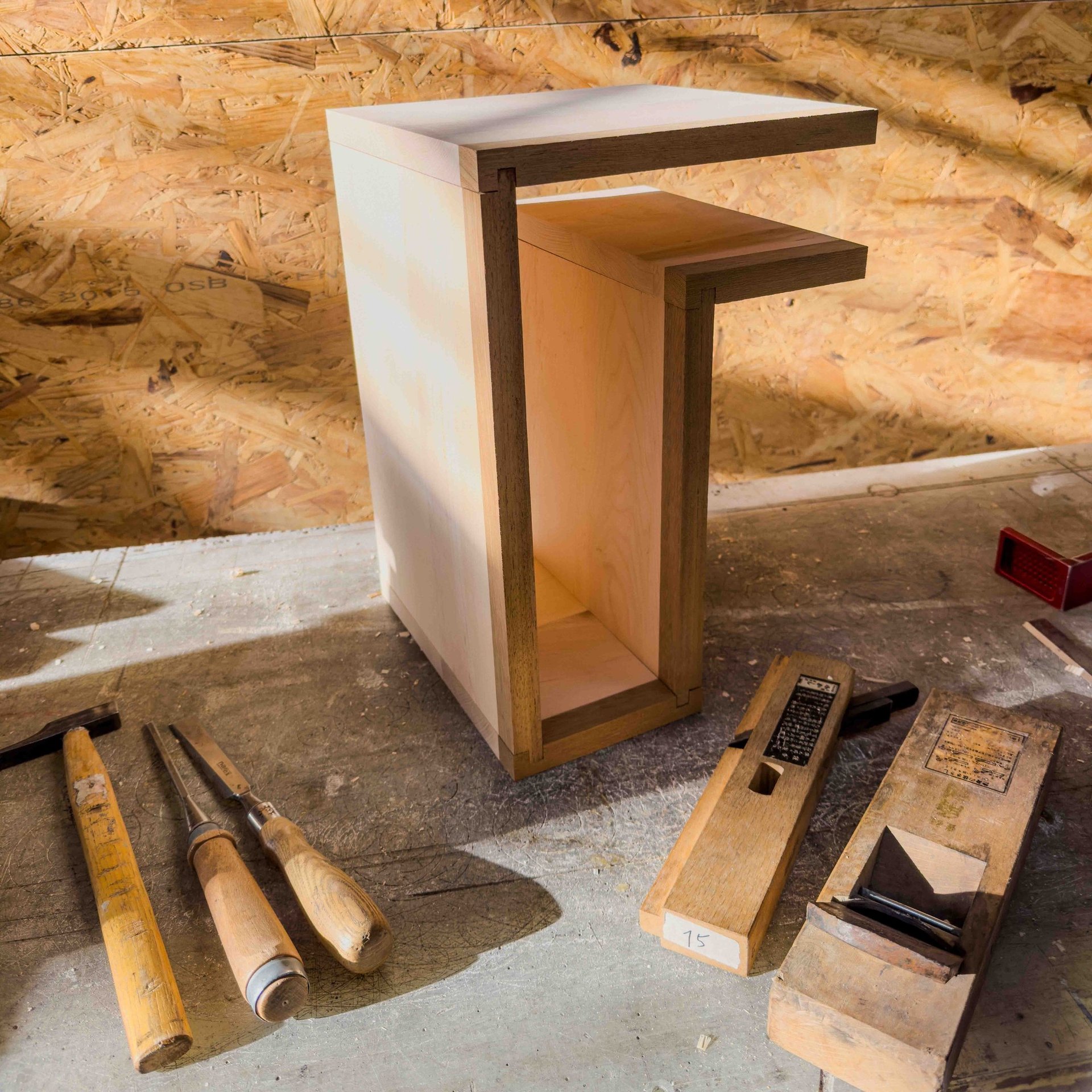 an abstract photo of a curved building with a blue sky in the background