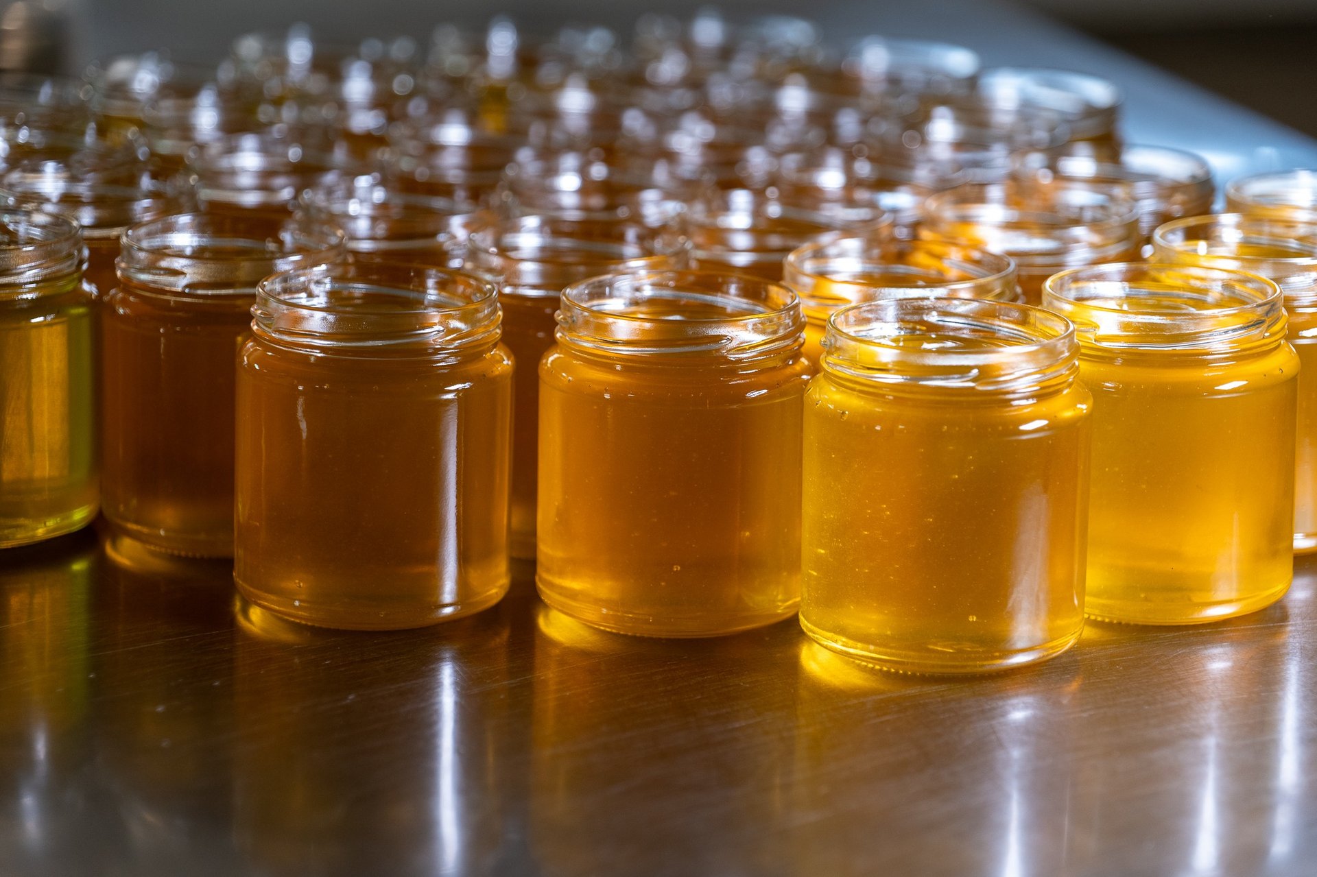 an abstract photo of a curved building with a blue sky in the background