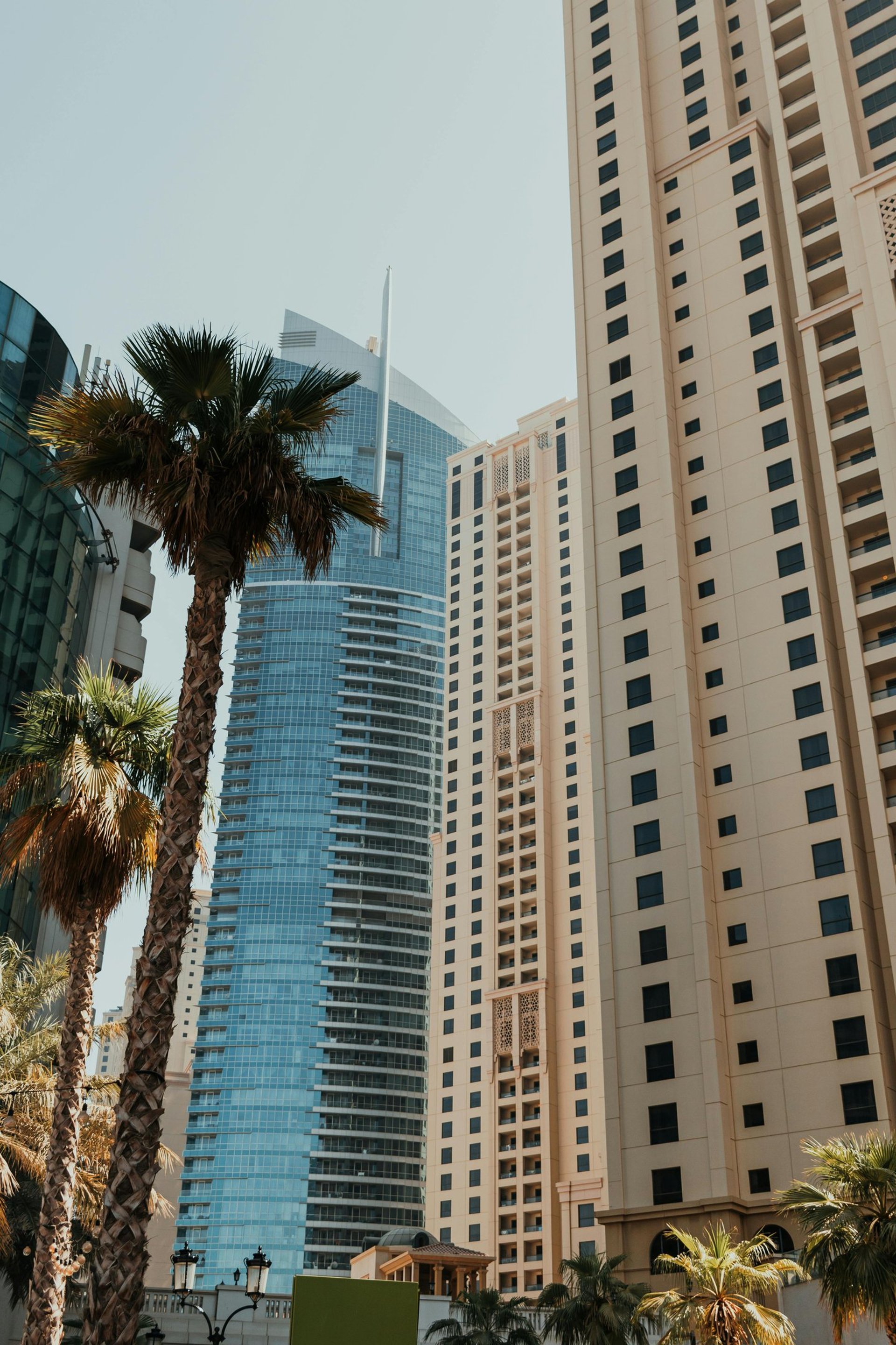 an abstract photo of a curved building with a blue sky in the background