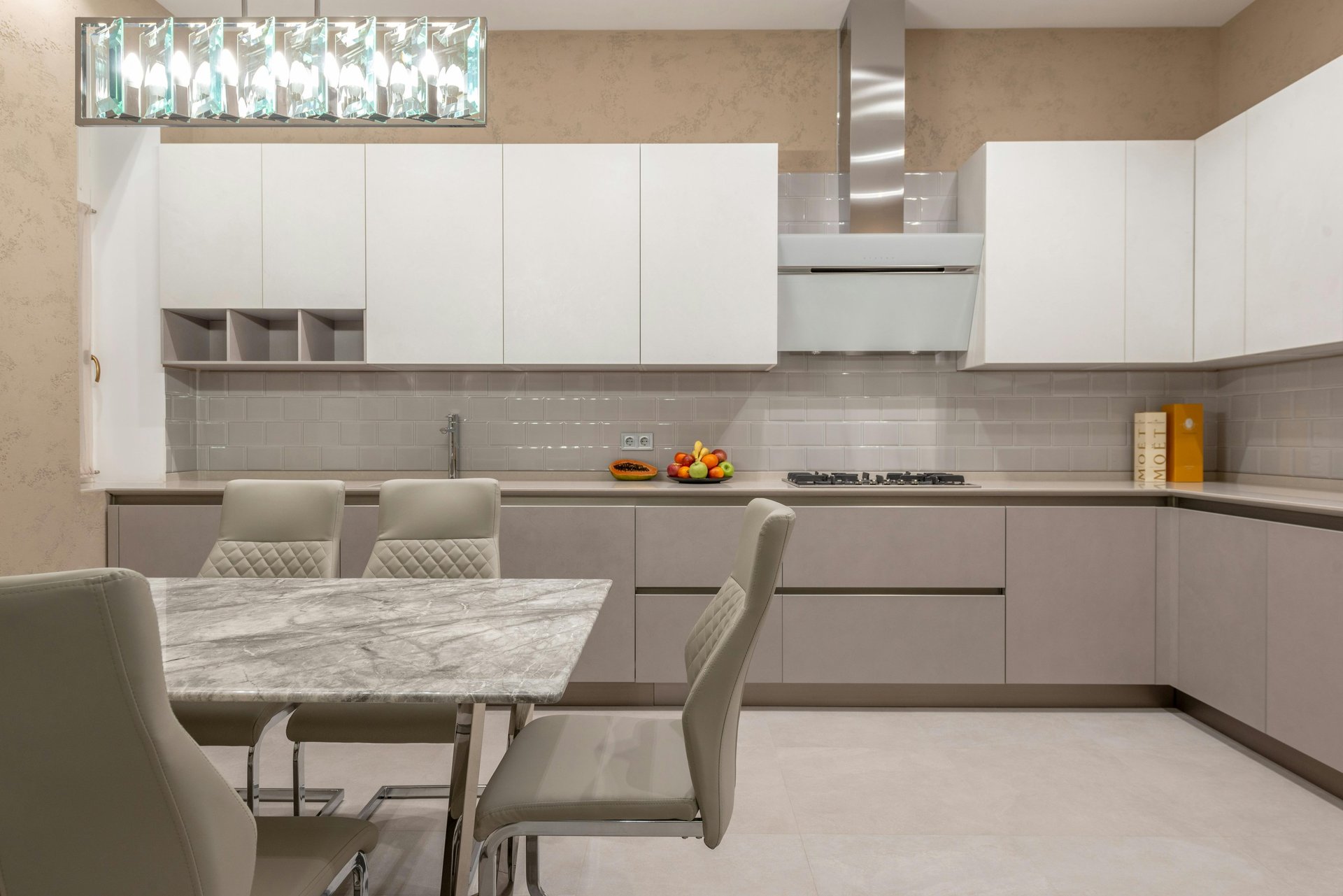 a modern kitchen with a bar and stools