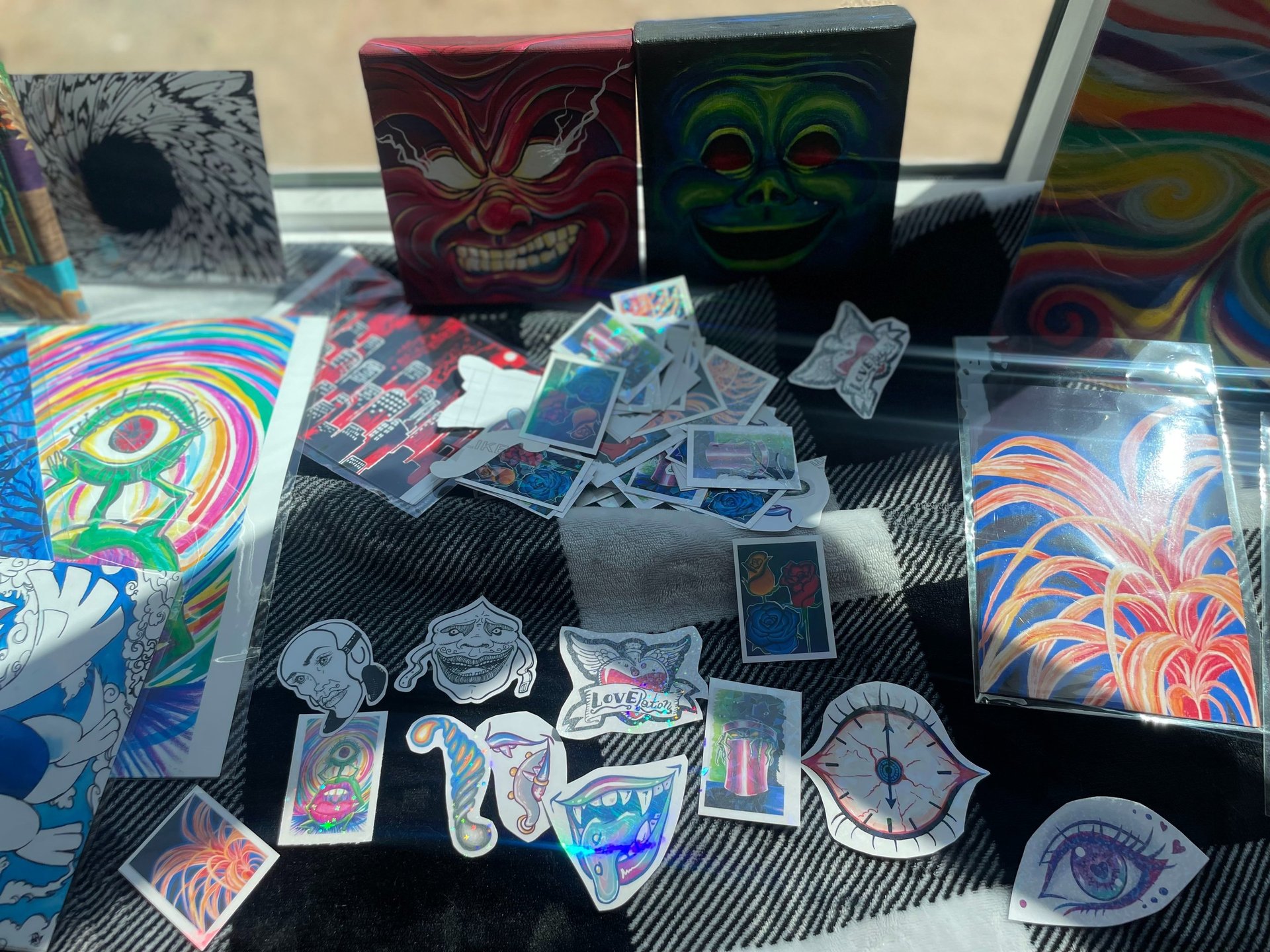 image of handmade stickers, art prints, and paintings