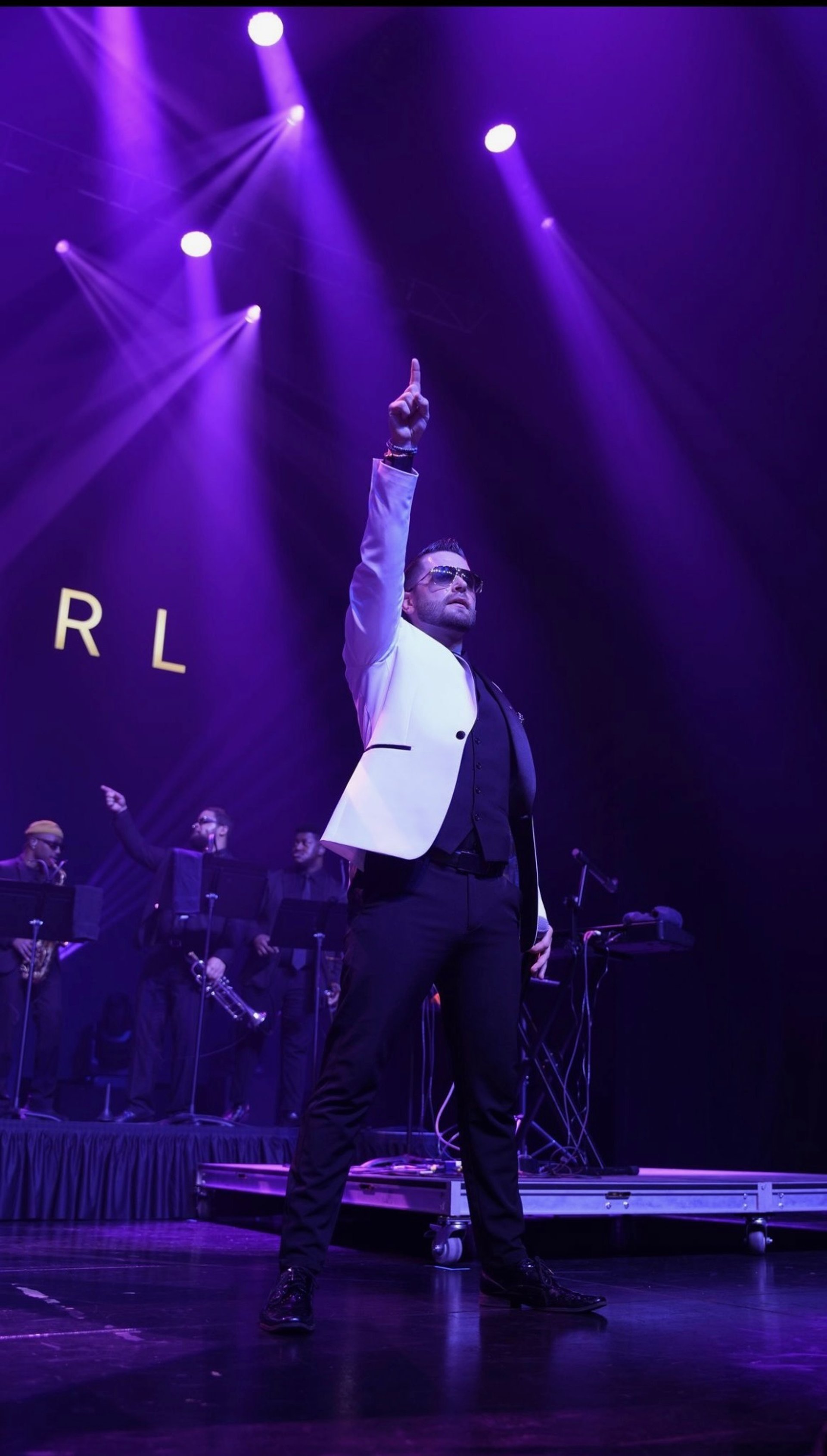 an abstract photo of a curved building with a blue sky in the background