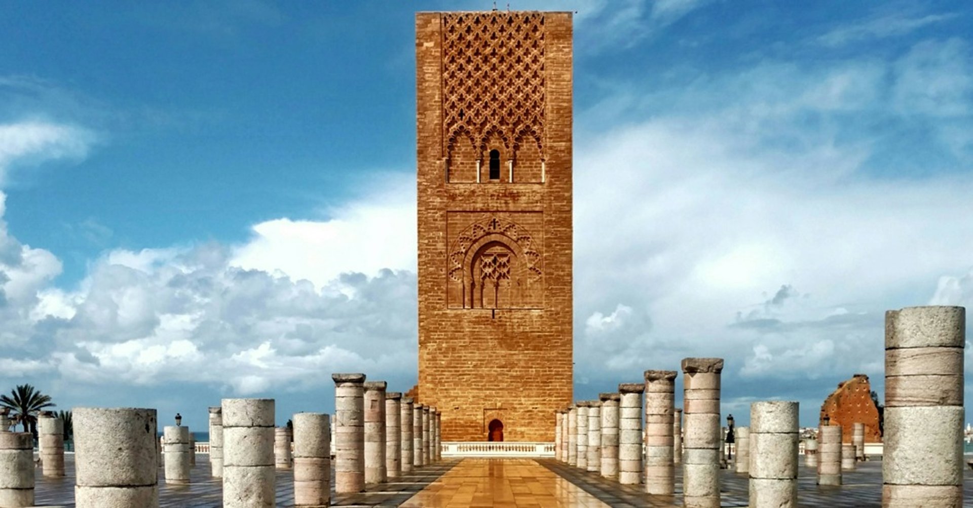 a view of a city with tall buildings and a clock tower