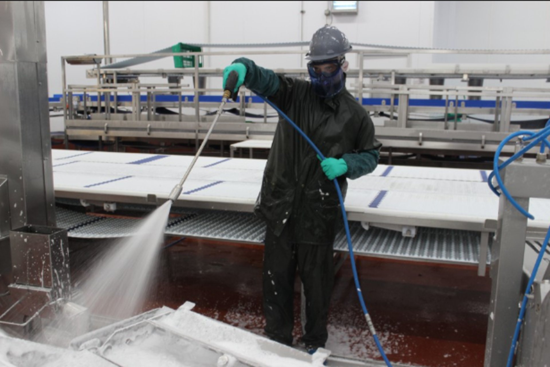 an abstract photo of a curved building with a blue sky in the background