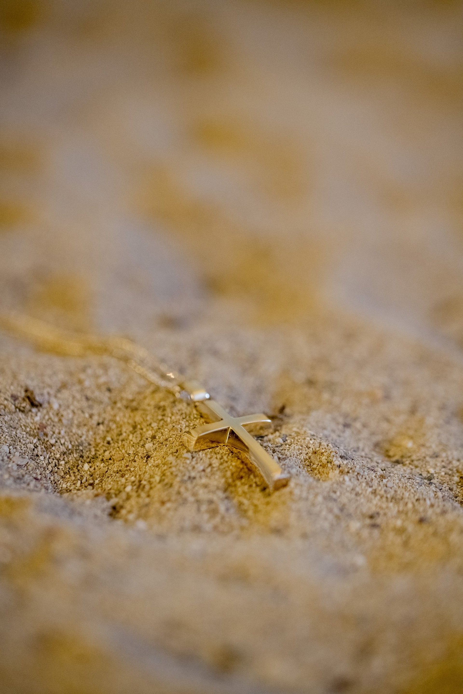 woman in white floral strapless dress holding flowers