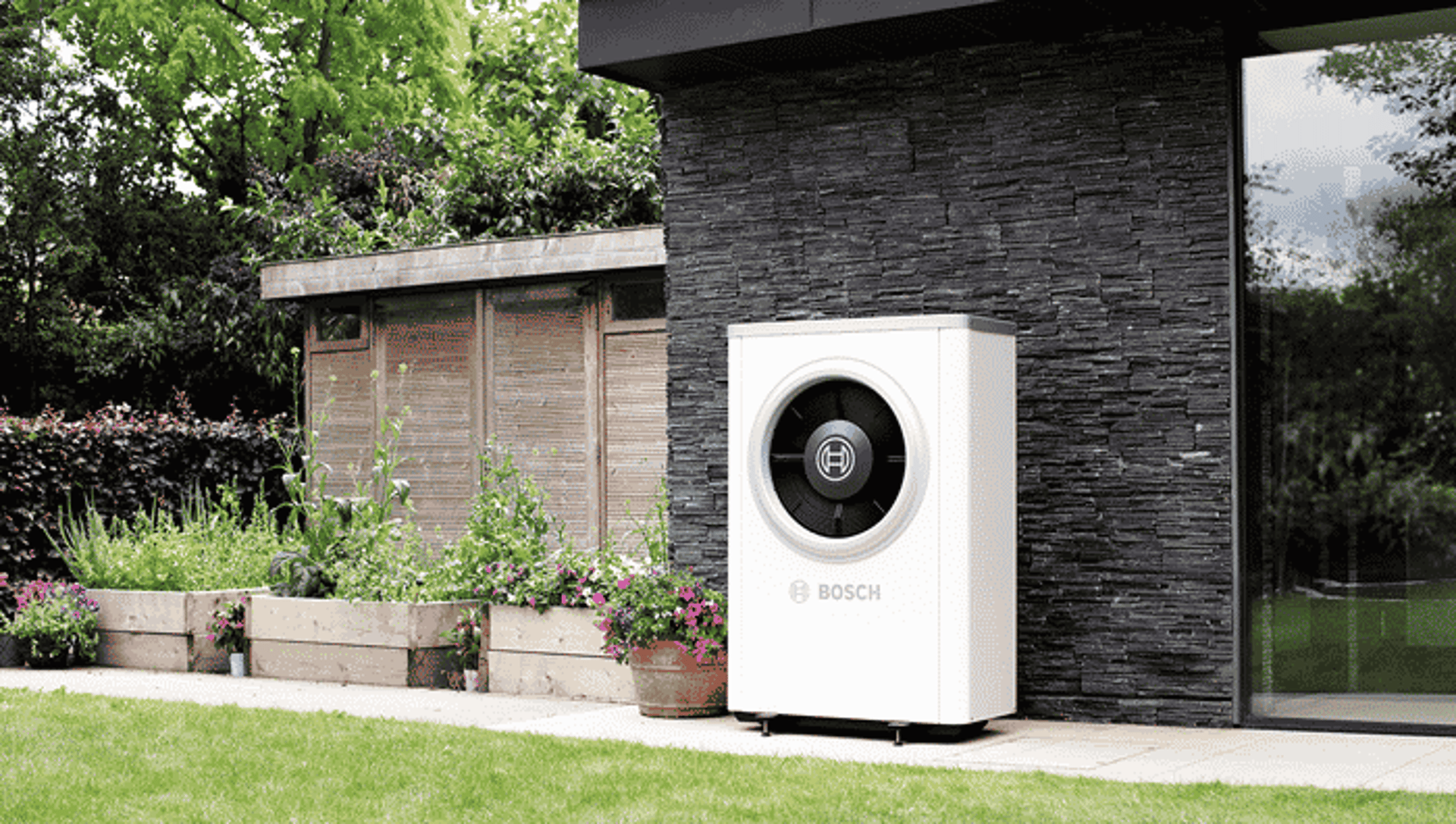 Modern house exterior with heat pump unit.