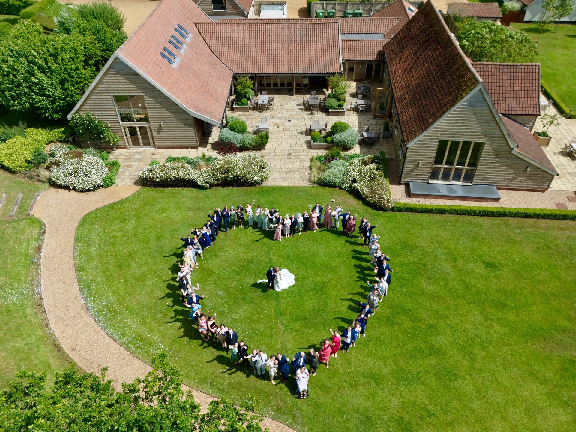 man in white dress shirt holding woman in white dress