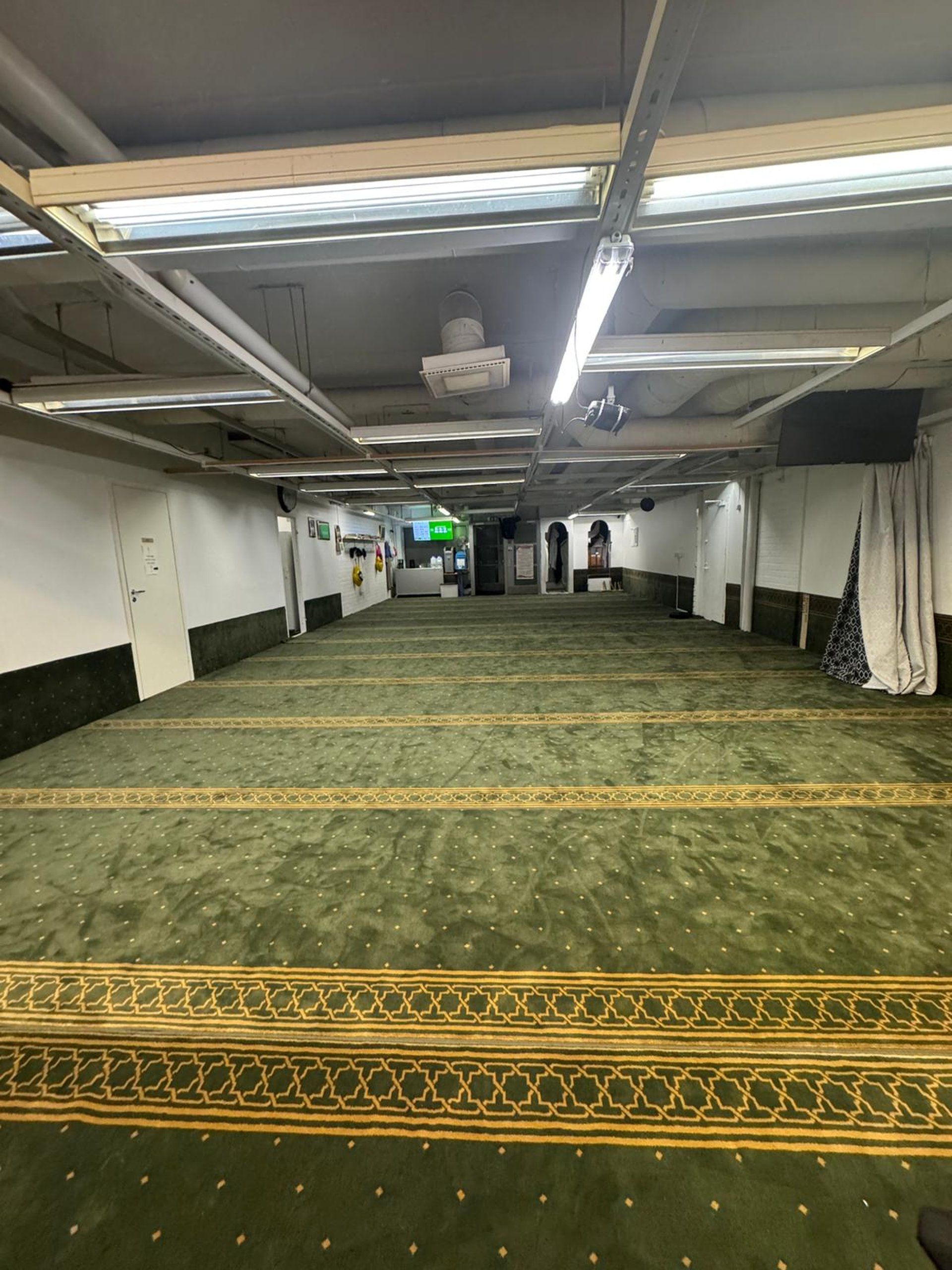 A man prays silently in a mosque.