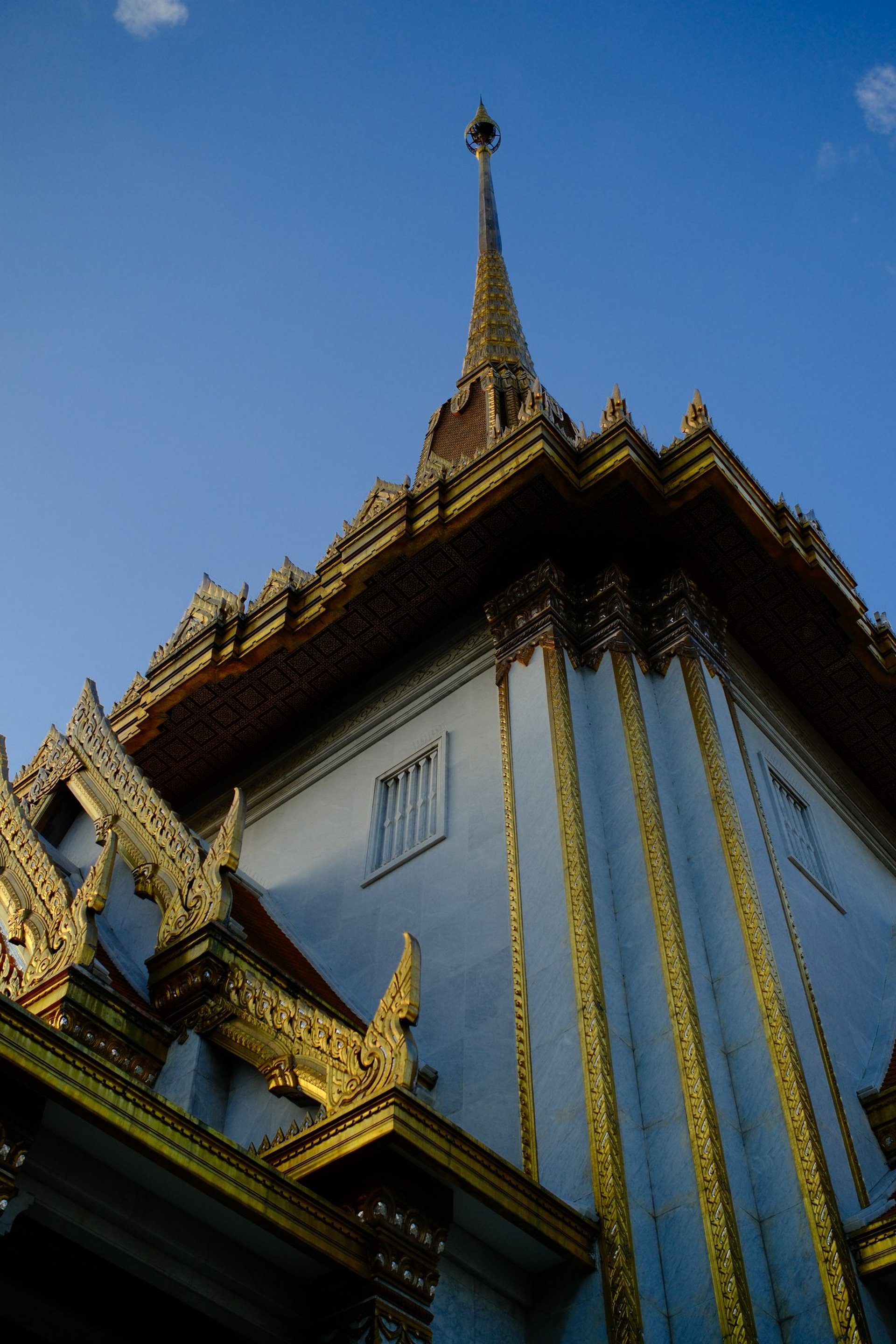 body of water near mountain during daytime
