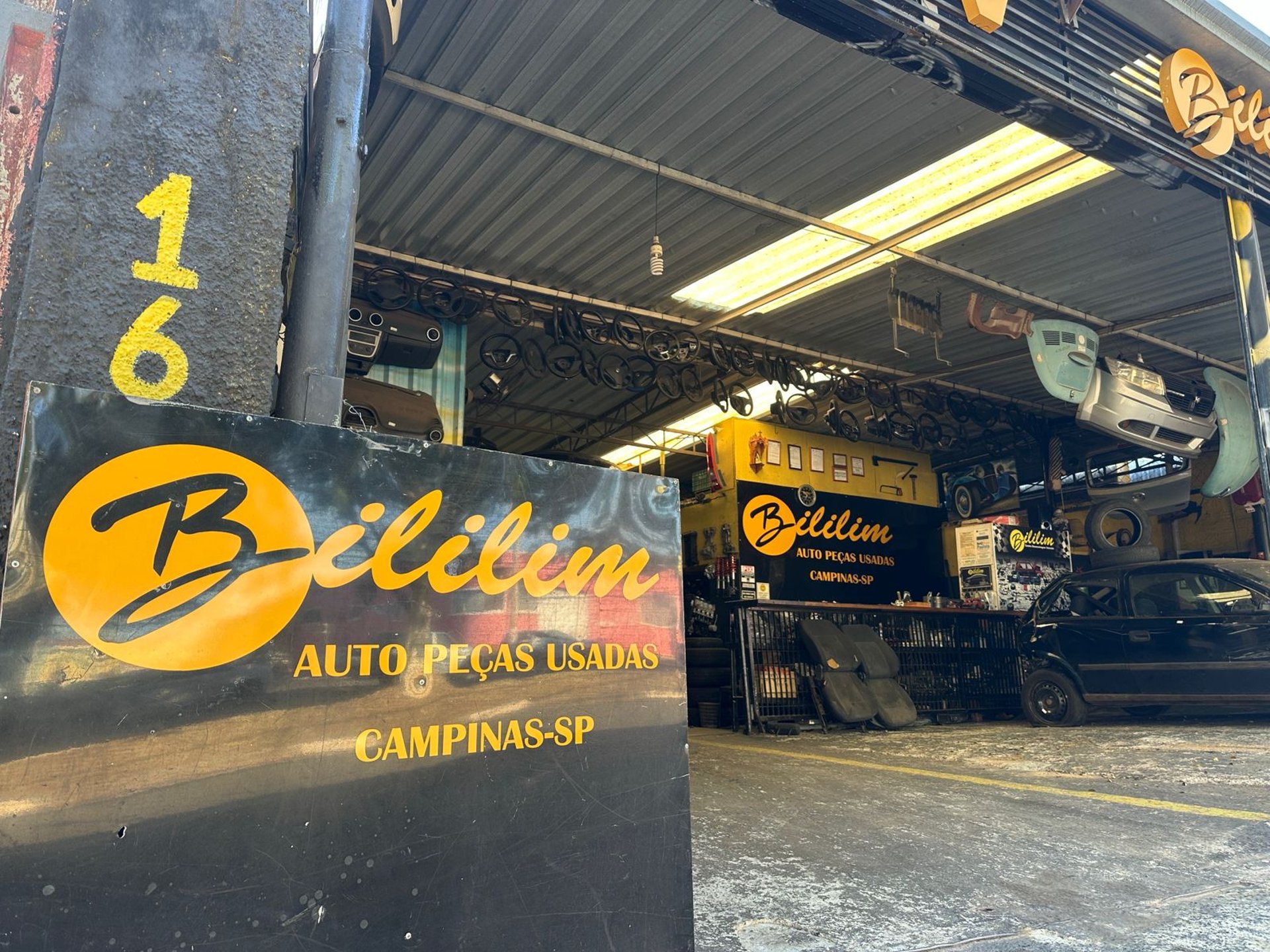 woman wearing yellow long-sleeved dress under white clouds and blue sky during daytime